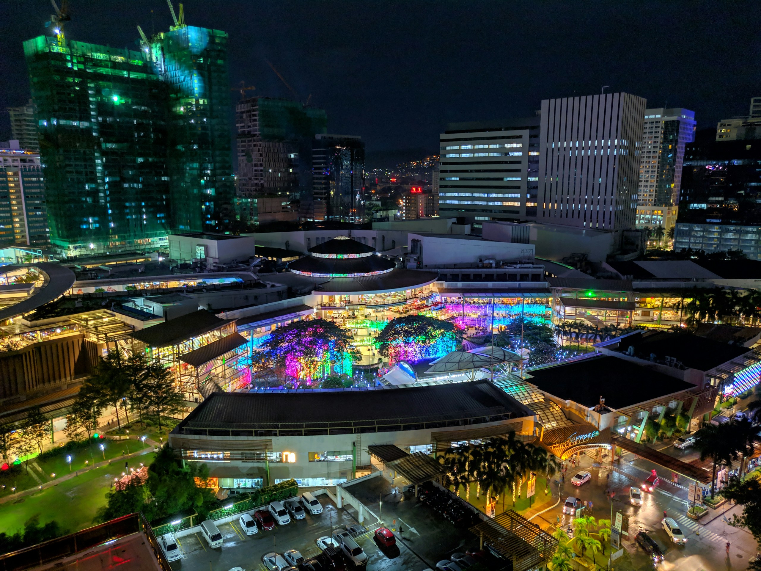 Night View of Illuminated City Buildings and Colorful Plaza HD Wallpaper
