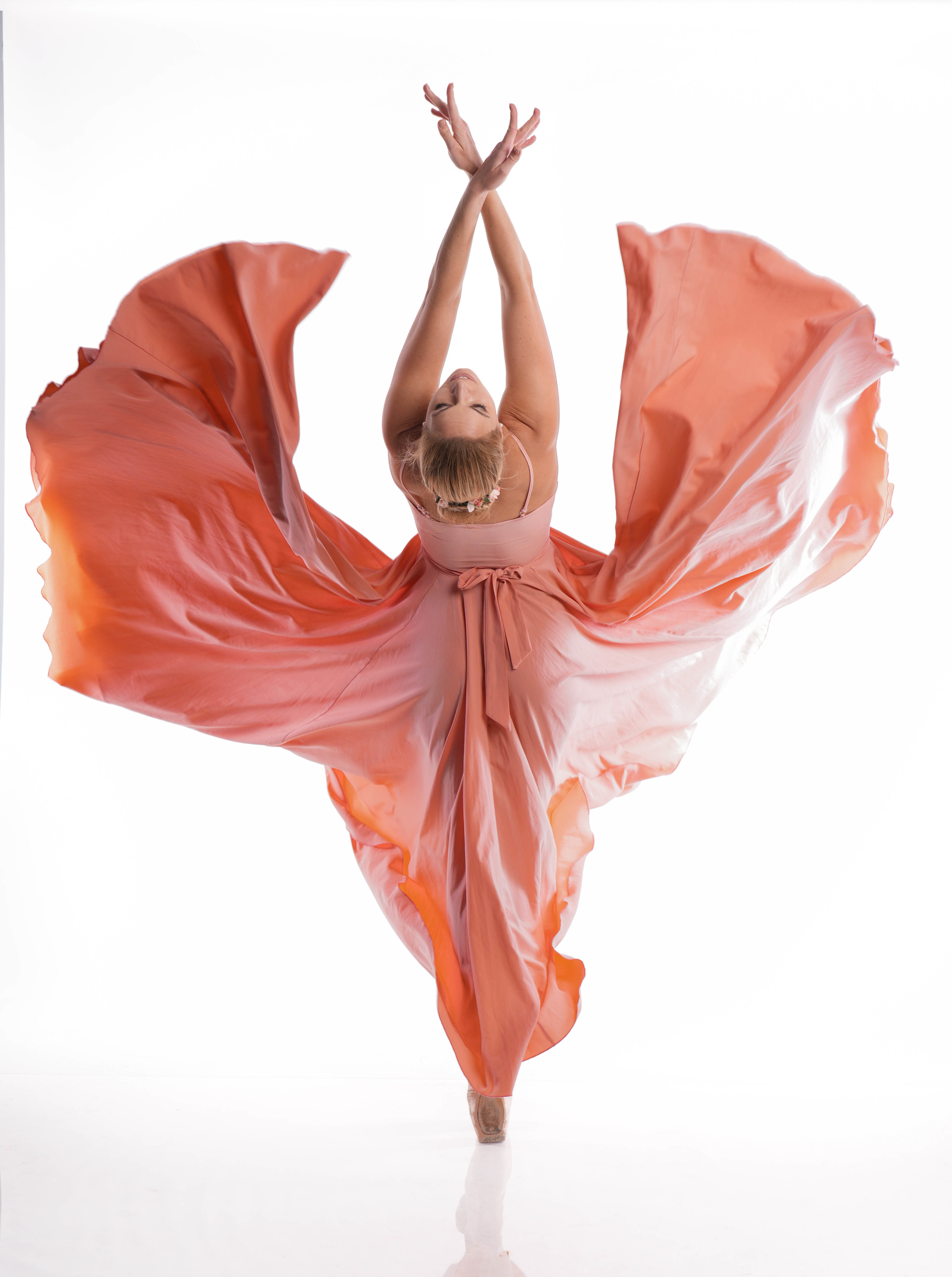 Ballet Dancer in Flowing Peach Dress HD Wallpaper