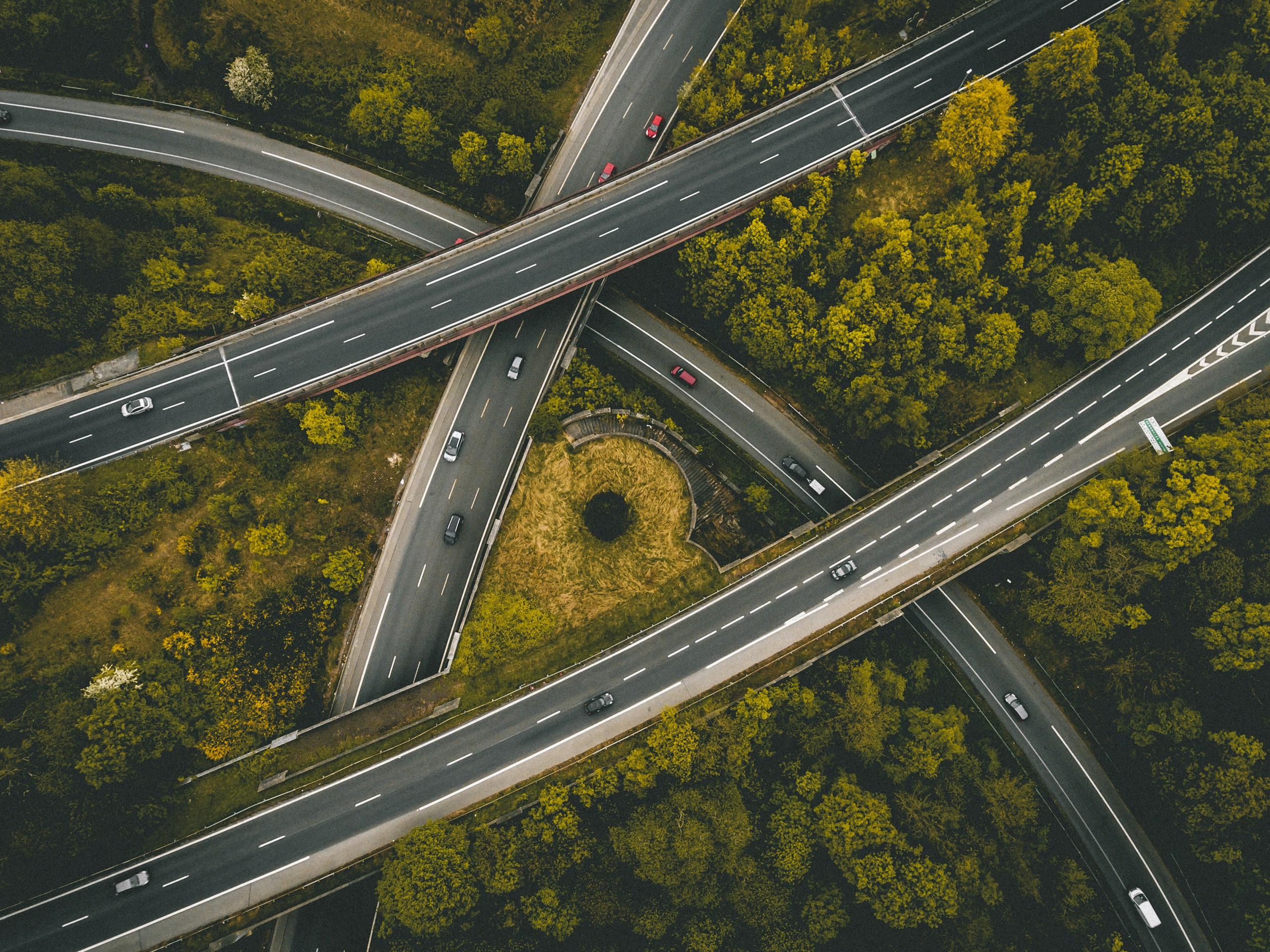 Aerial view of interlocking highway overpasses HD Wallpaper