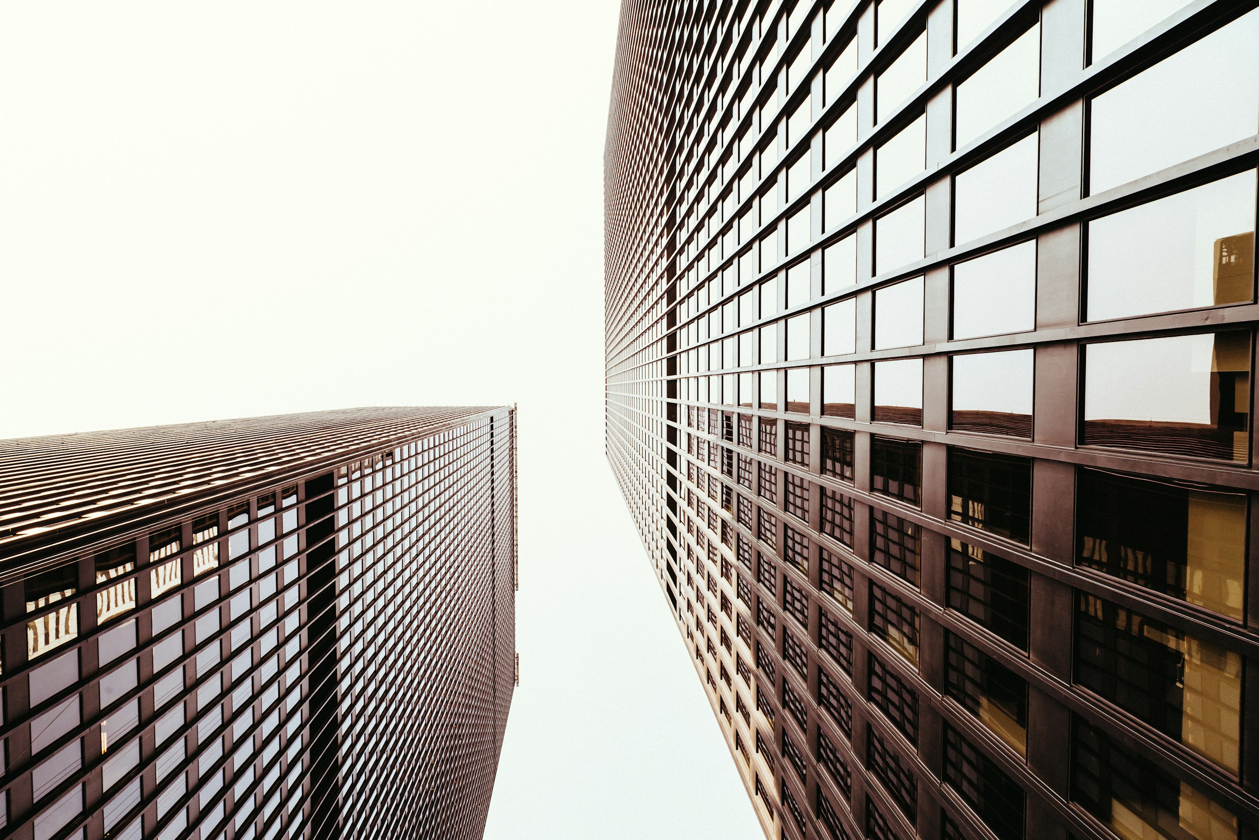 Low Angle View of Two Modern Skyscrapers HD Wallpaper