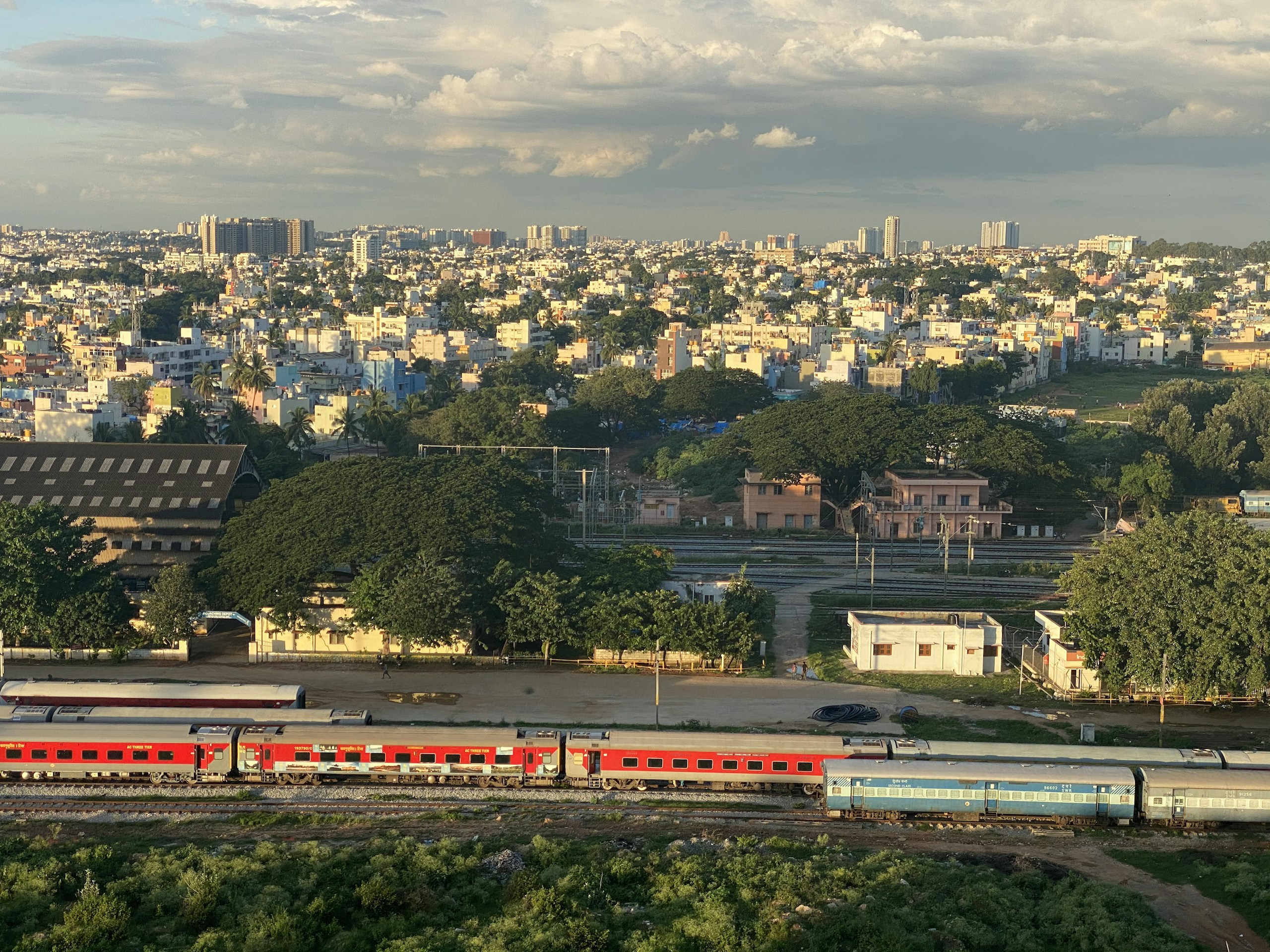 Wide Shot of City Skyline and Trains HD Wallpaper