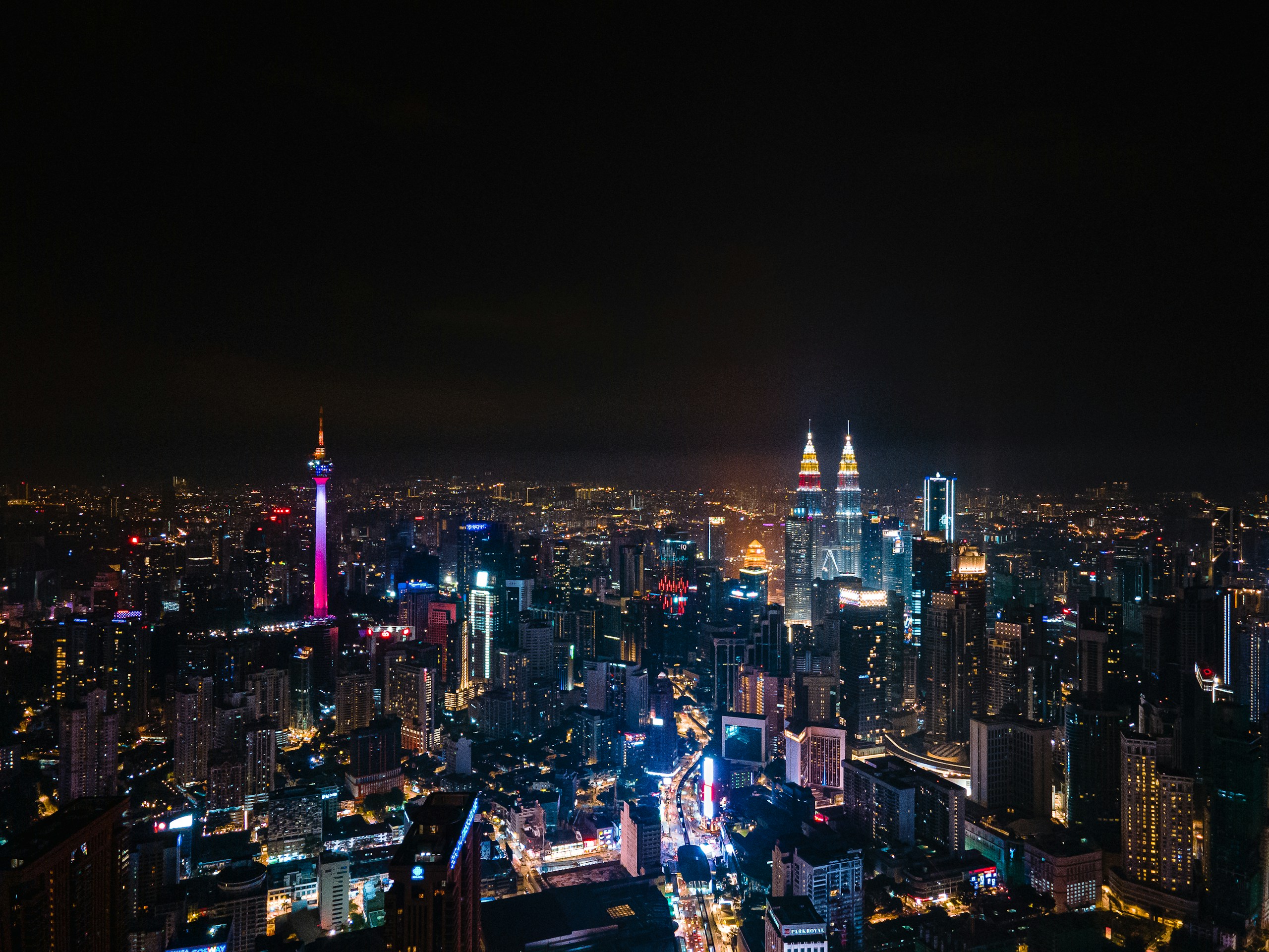 Kuala Lumpur Skyline at Night with Petronas Towers HD Wallpaper