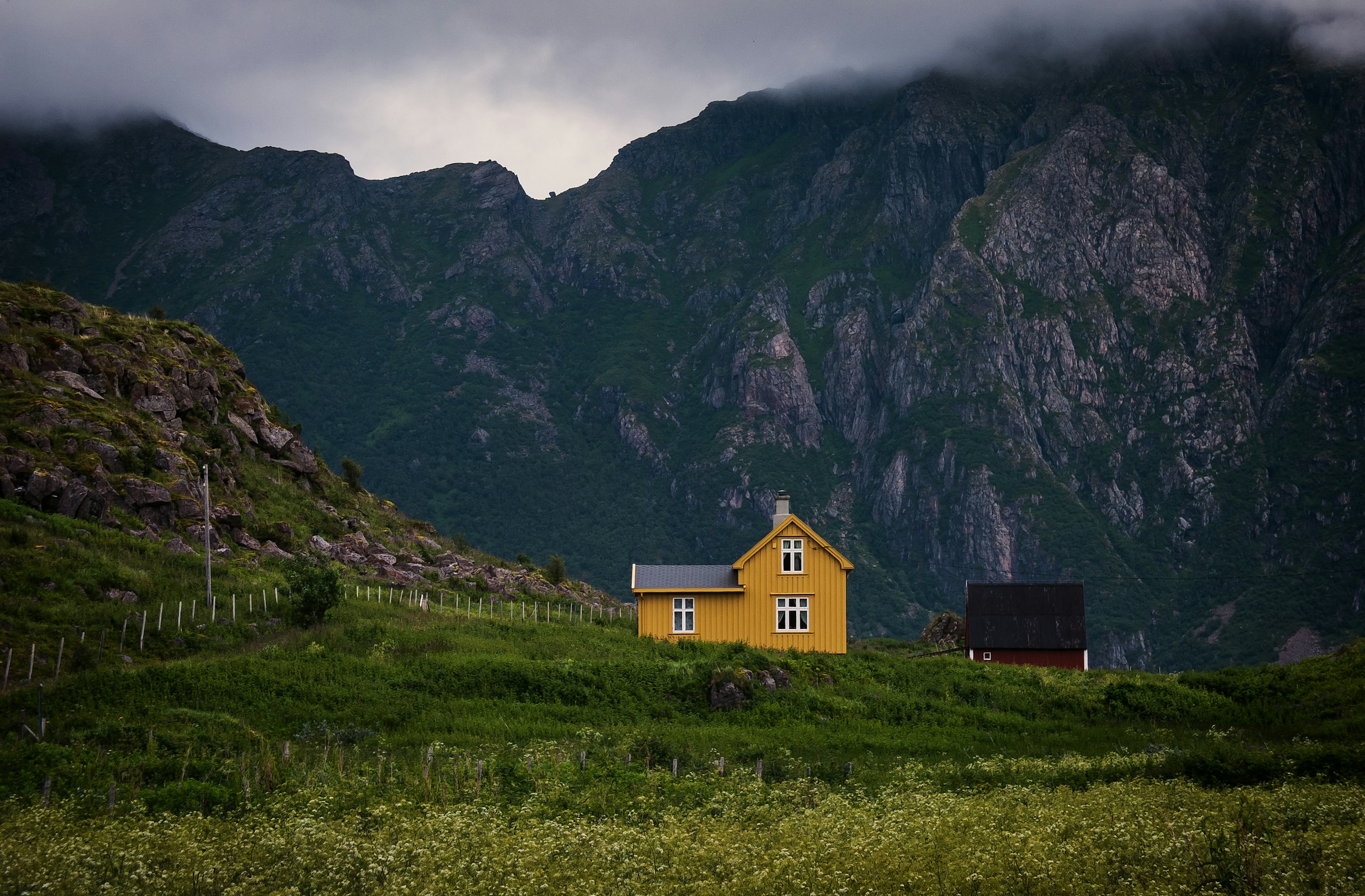 Yellow wooden house in a mountainous landscape HD Wallpaper