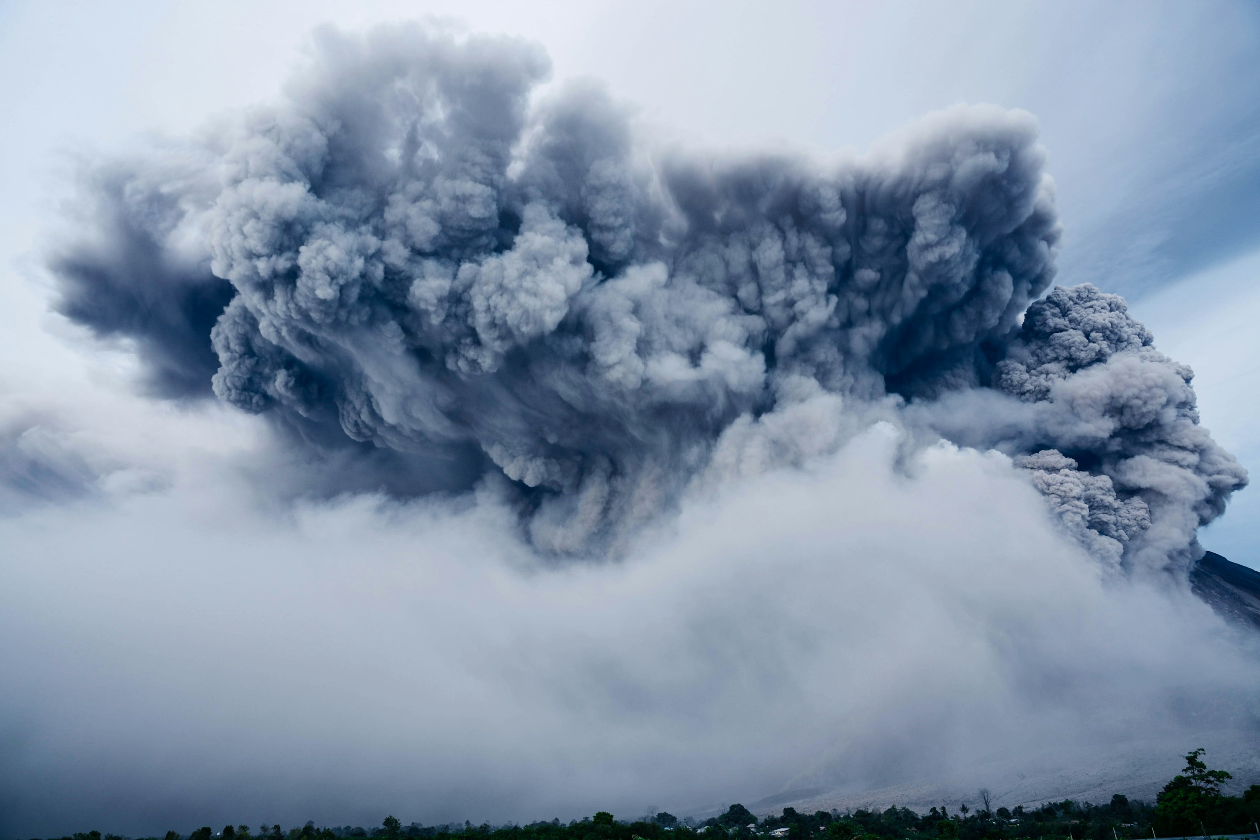 Massive Volcanic Eruption with Billowing Ash Cloud HD Wallpaper