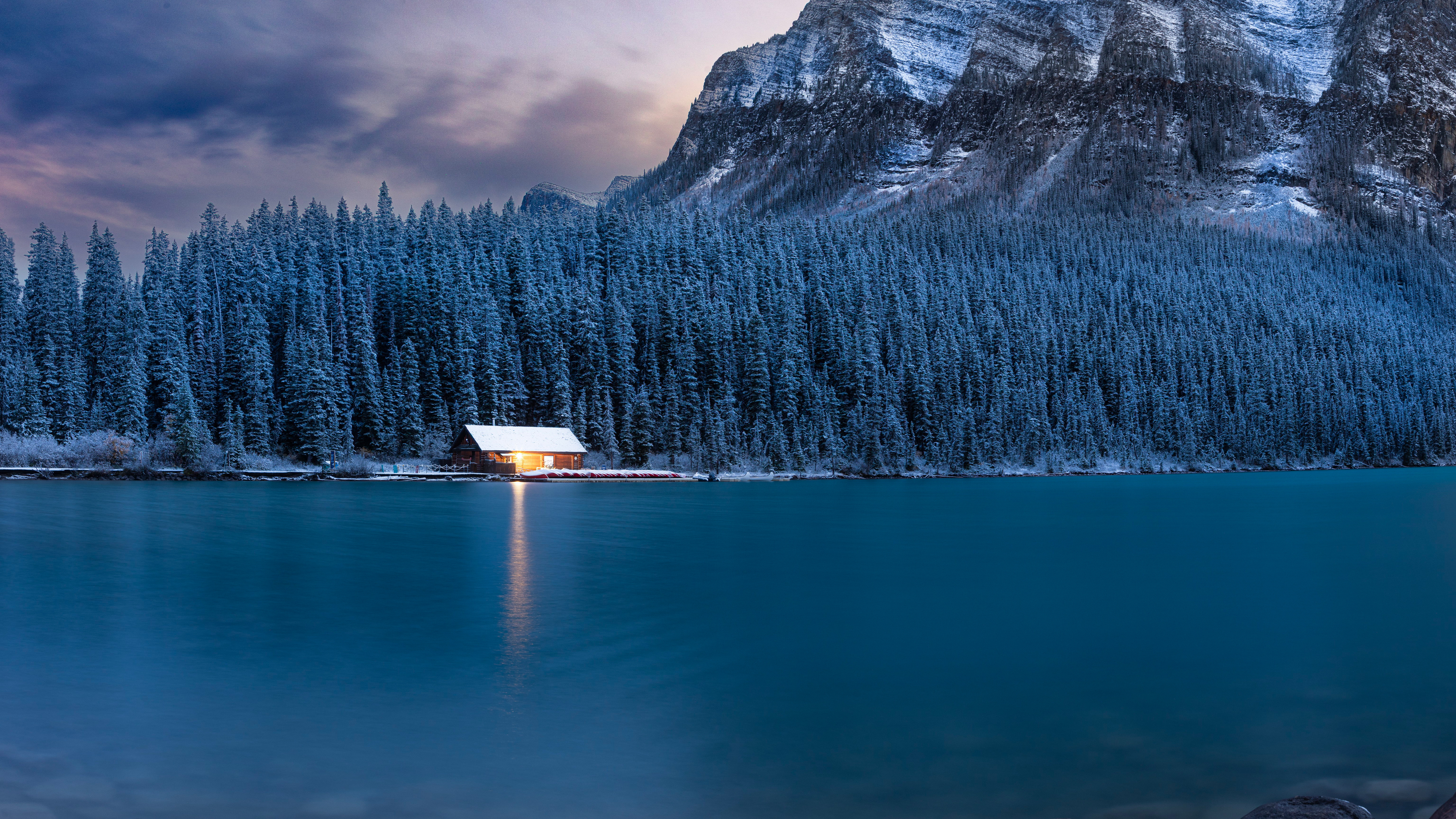 Lit boathouse on Lake Louise in winter HD Wallpaper