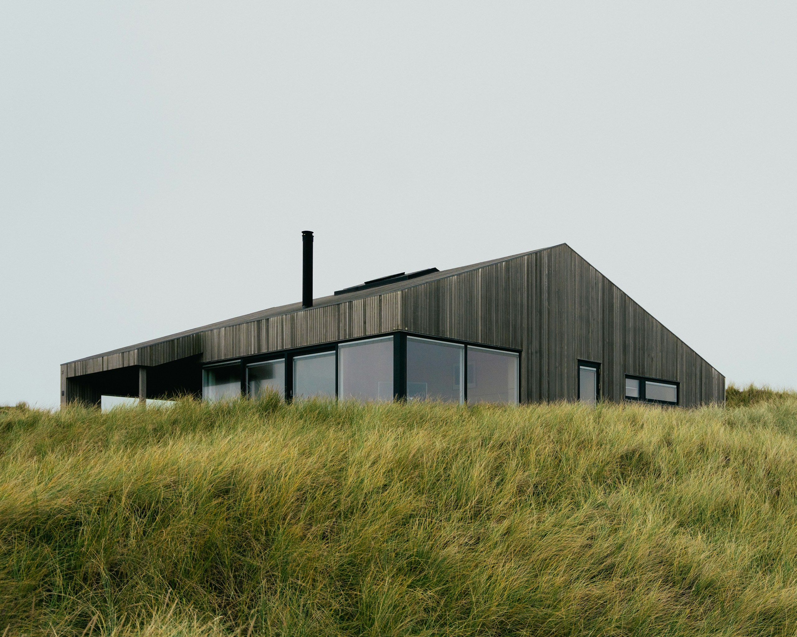 Modern Wooden Summer House on Grassy Hill HD Wallpaper