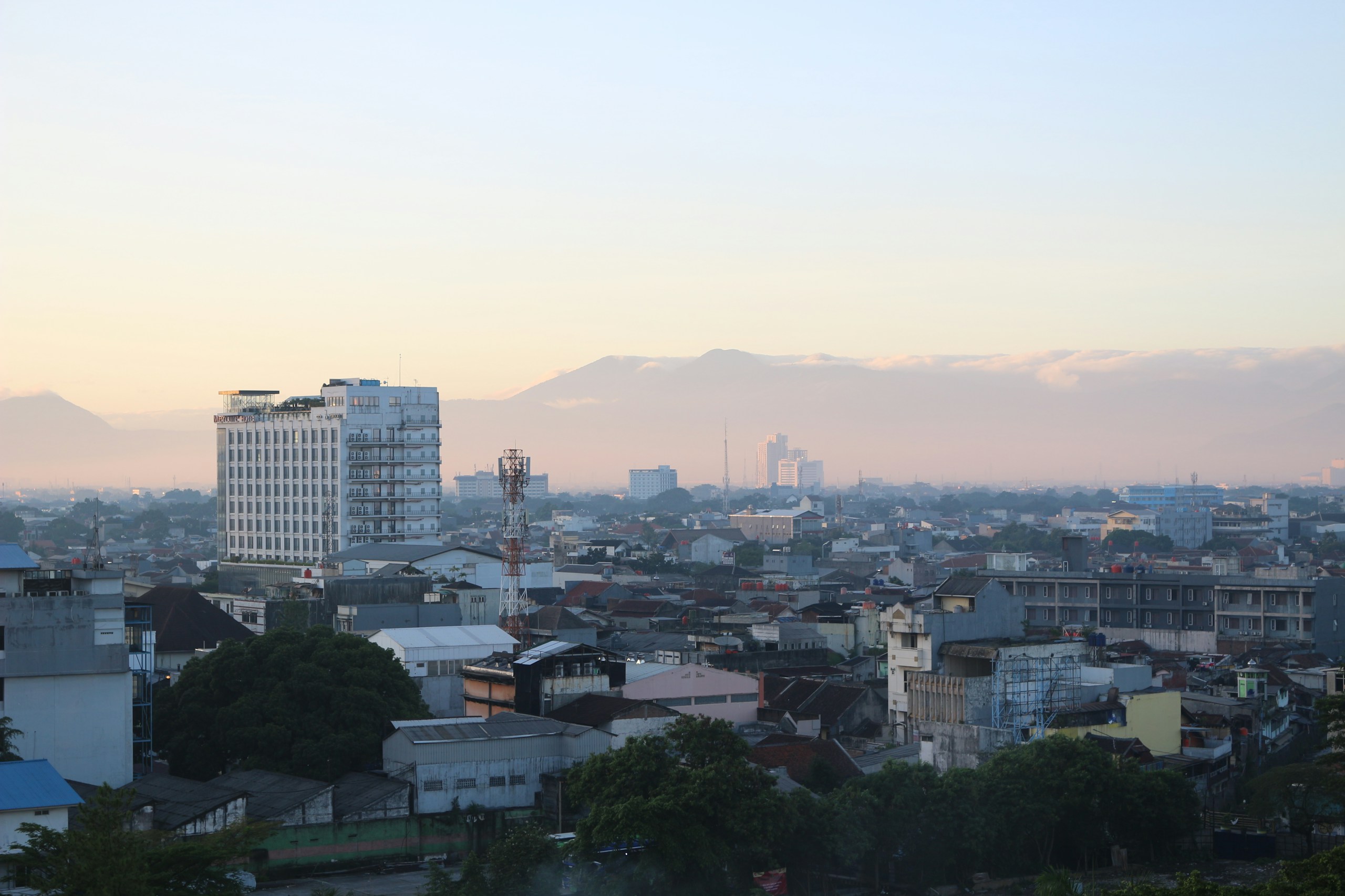 Cityscape of Bandung with Mountains in the Background HD Wallpaper