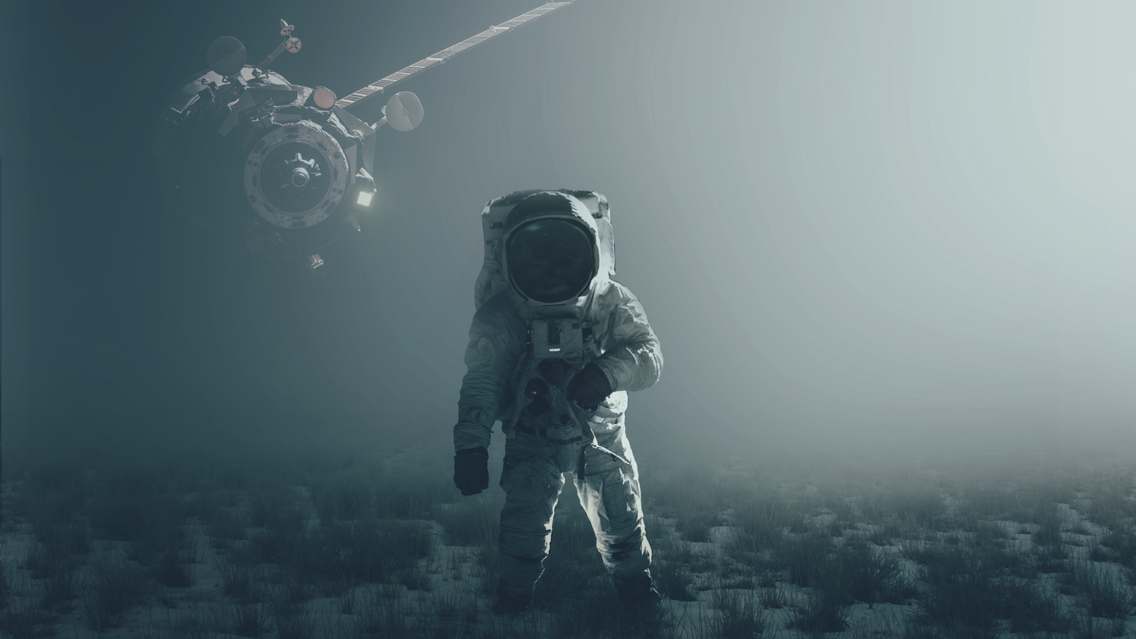 Astronaut standing on foggy ground with floating spacecraft HD Wallpaper