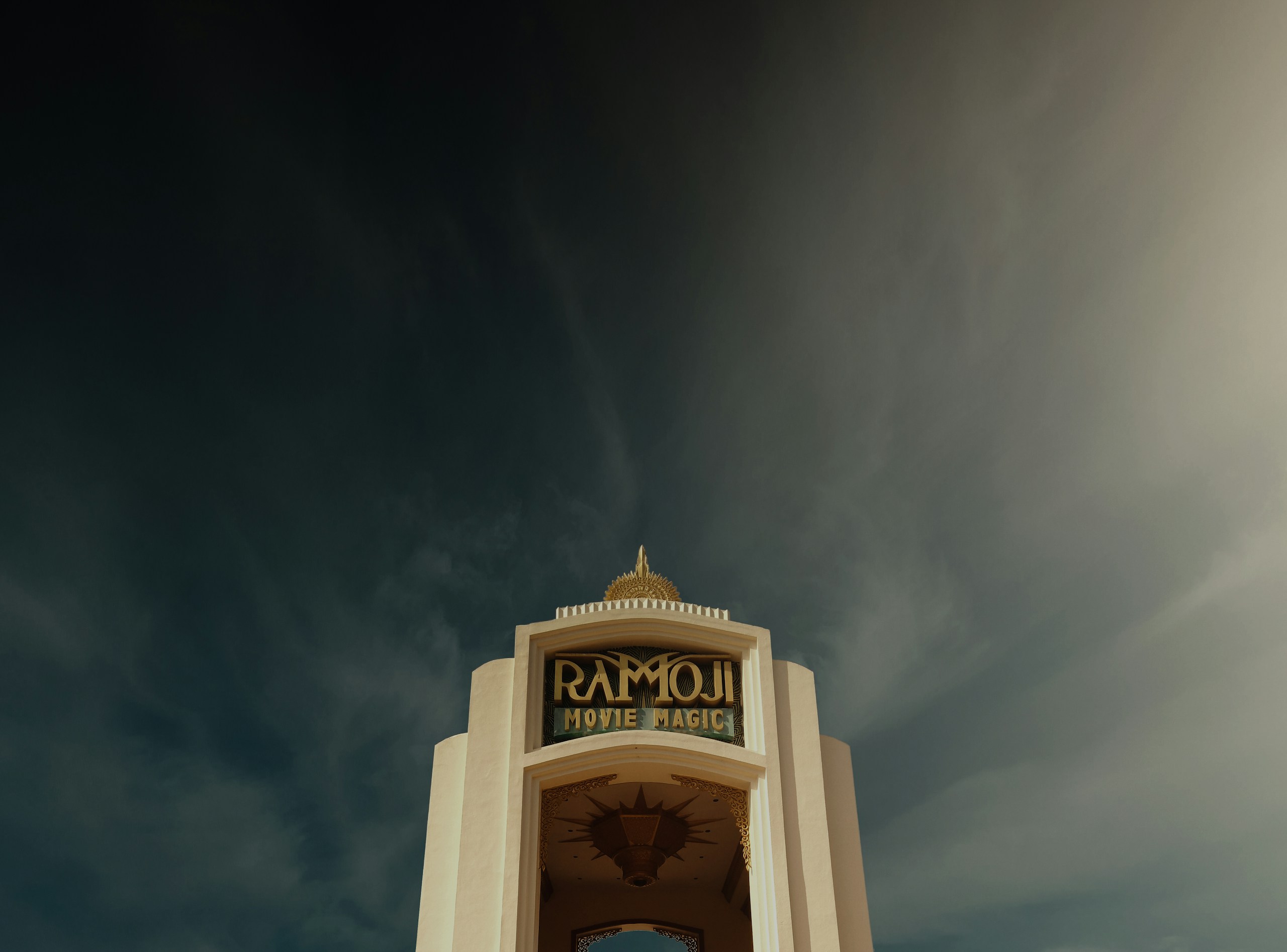 Ramoji Movie Magic Entrance Arch under Cloudy Sky HD Wallpaper