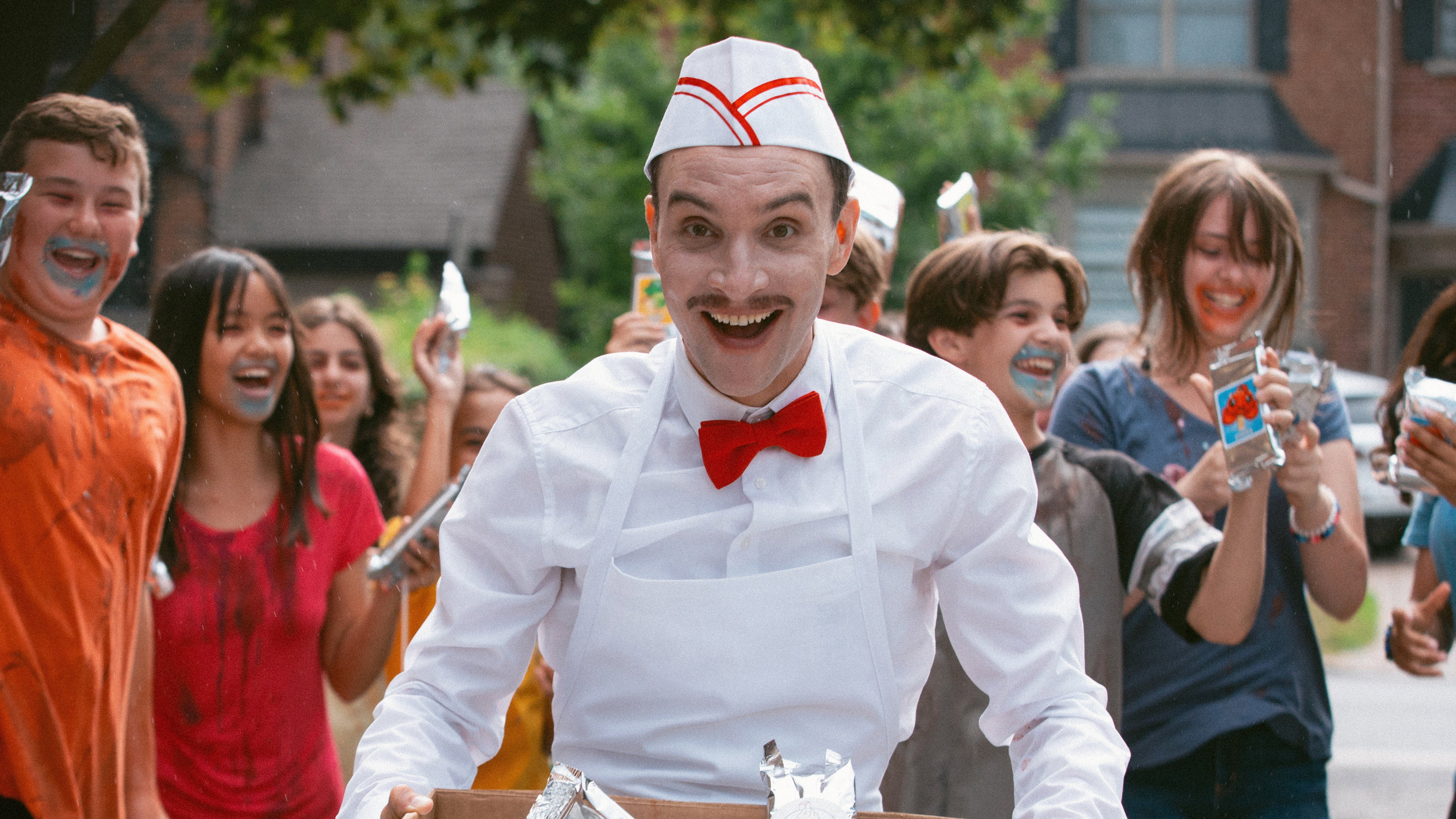 Ice Cream Man movie scene with smiling vendor and children HD Wallpaper