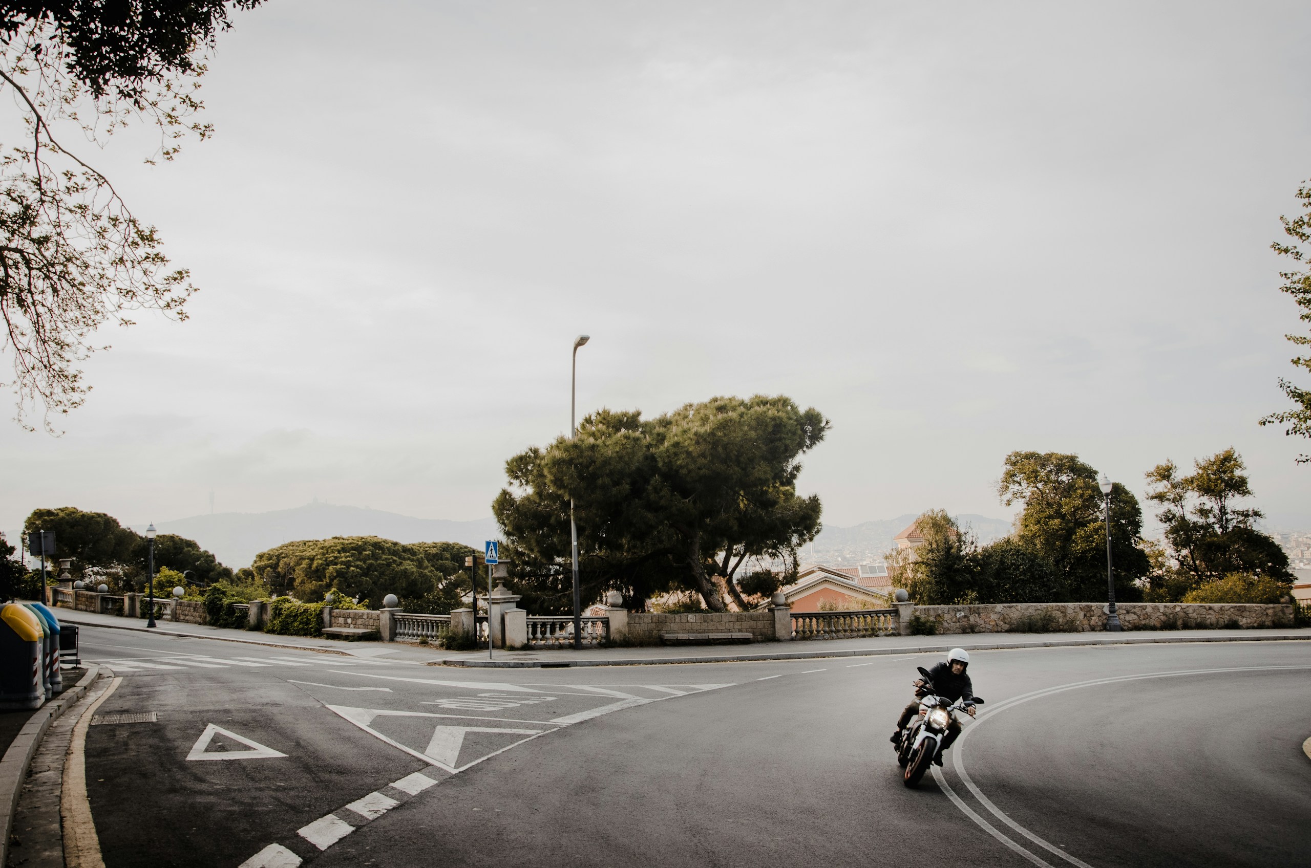 Man Riding a Motorcycle on a Curved Road HD Wallpaper