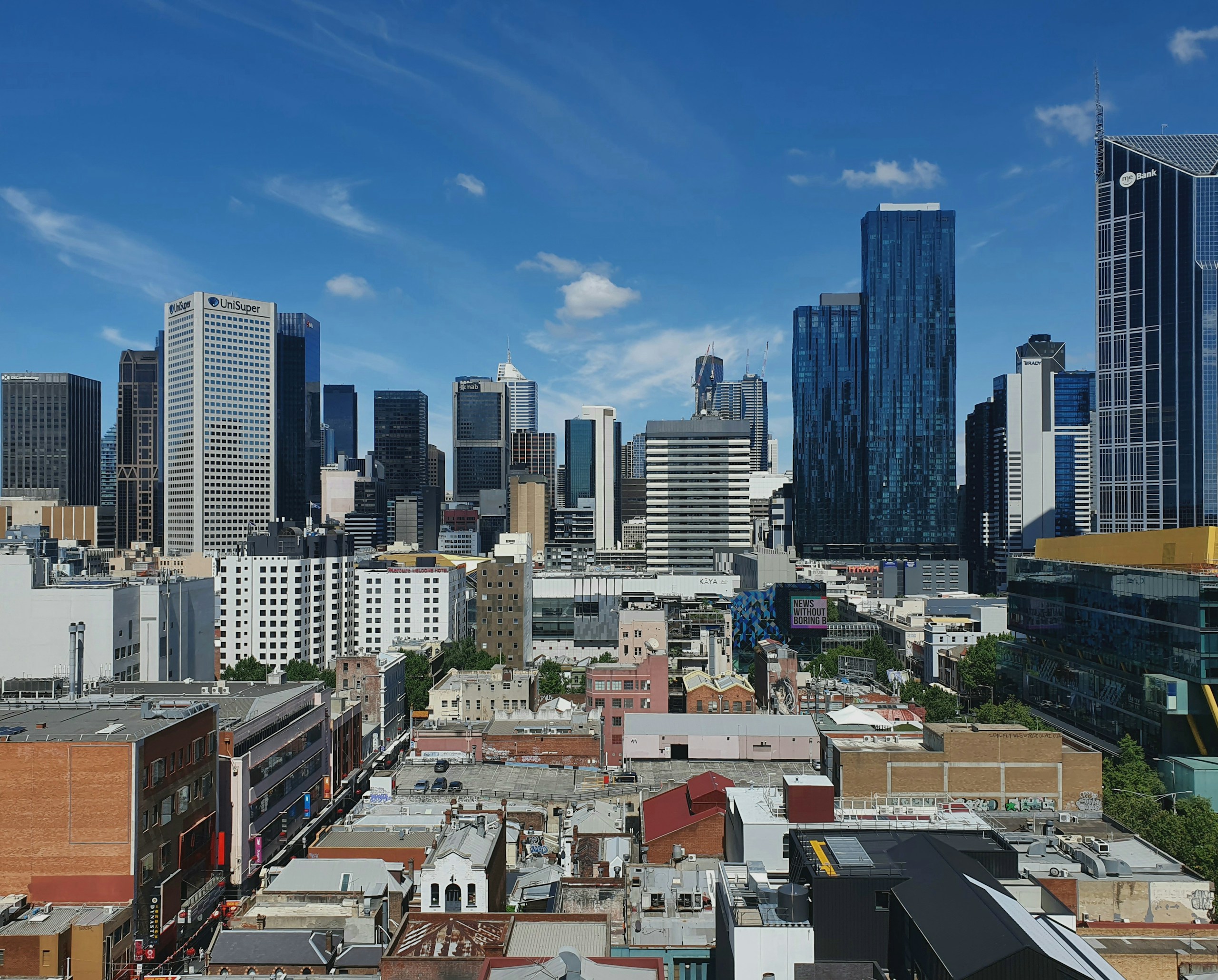 Melbourne City Skyline with Skyscrapers Under Blue Sky HD Wallpaper