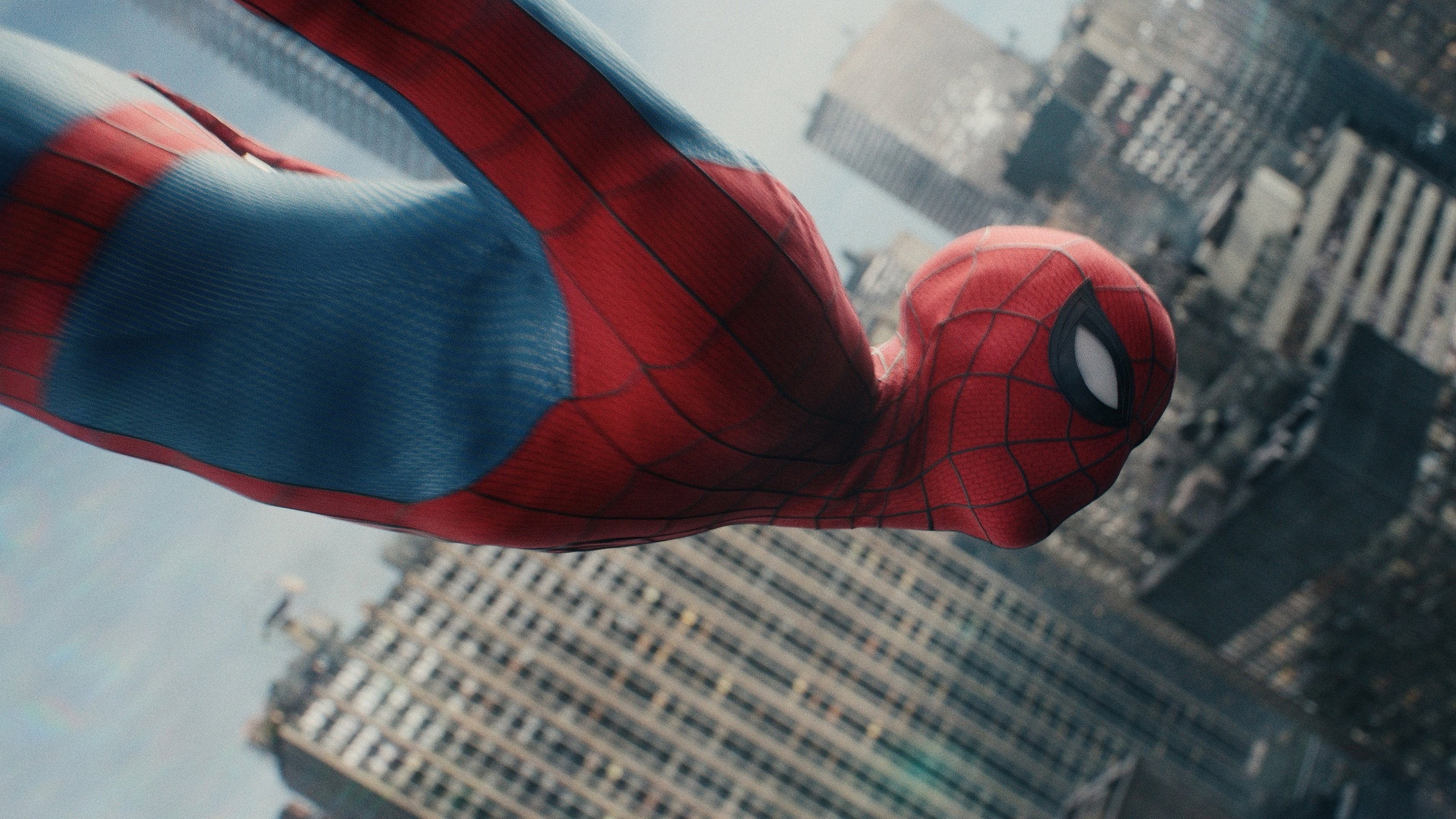 Spider-Man swinging through skyscrapers in Marvel movie HD Wallpaper