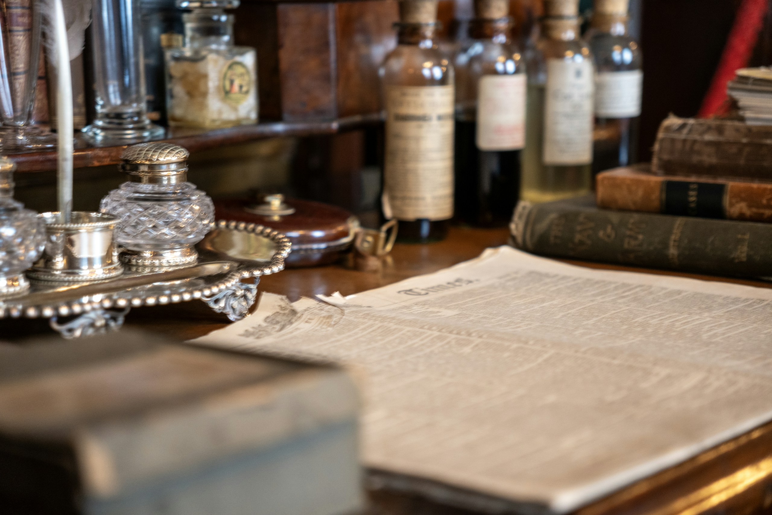 Vintage Desk with Newspaper and Inkwells HD Wallpaper