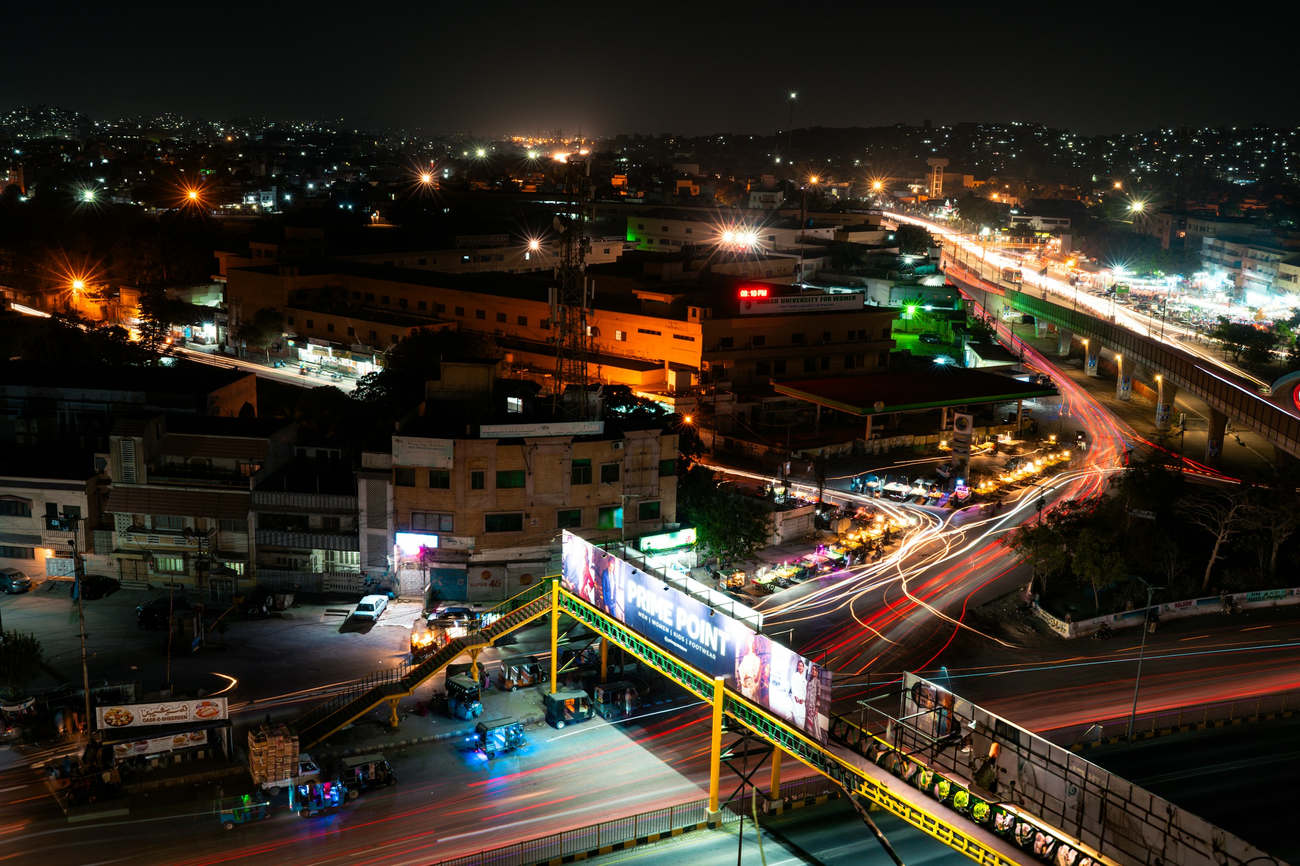 City Night View with Light Trails and Pedestrian Bridge HD Wallpaper