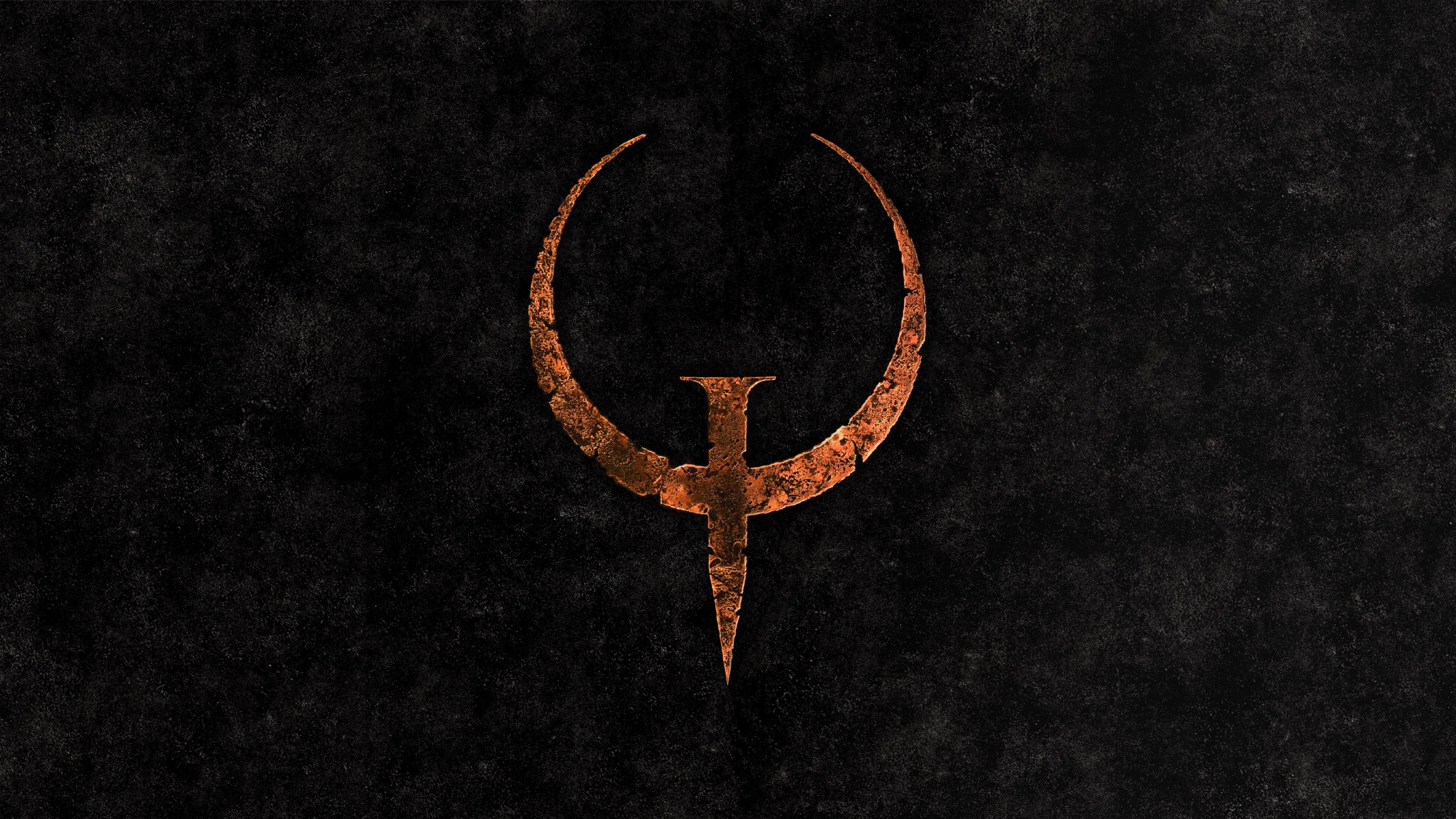 Quake Video Game Logo on Dark Textured Background HD Wallpaper