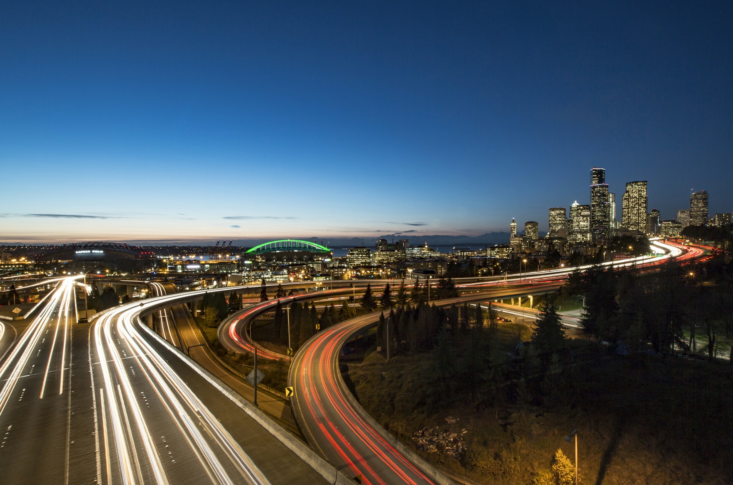 Seattle Skyline and Highway Light Trails at Night HD Wallpaper