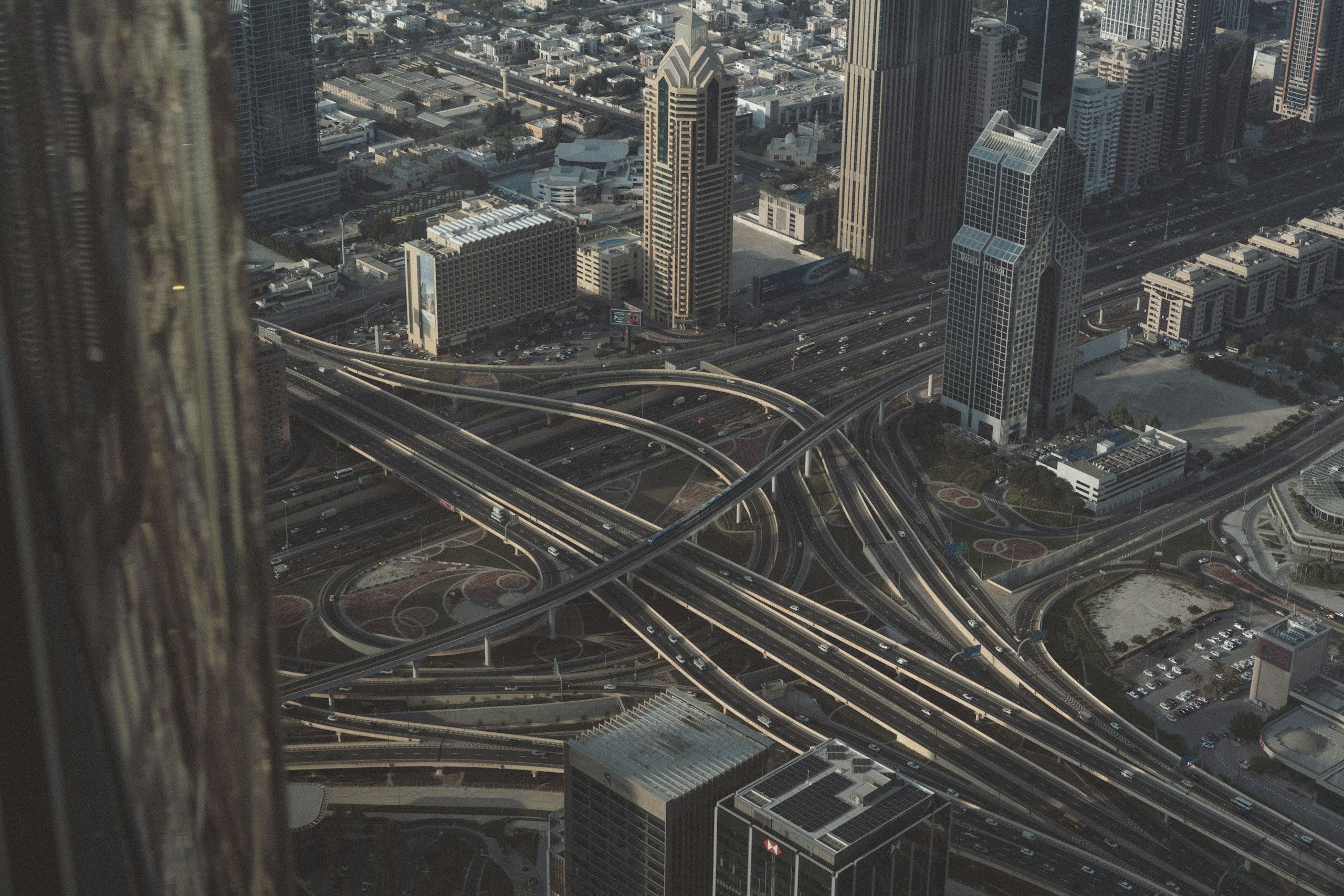 Aerial View of Dubai Highway Interchange and Skyscrapers HD Wallpaper
