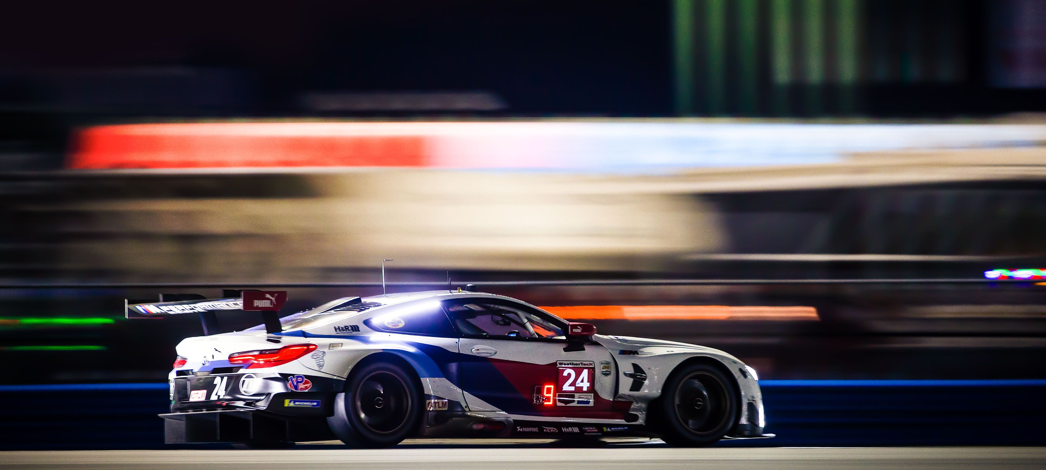 BMW M8 GTE Race Car Speeding on Track at Night HD Wallpaper