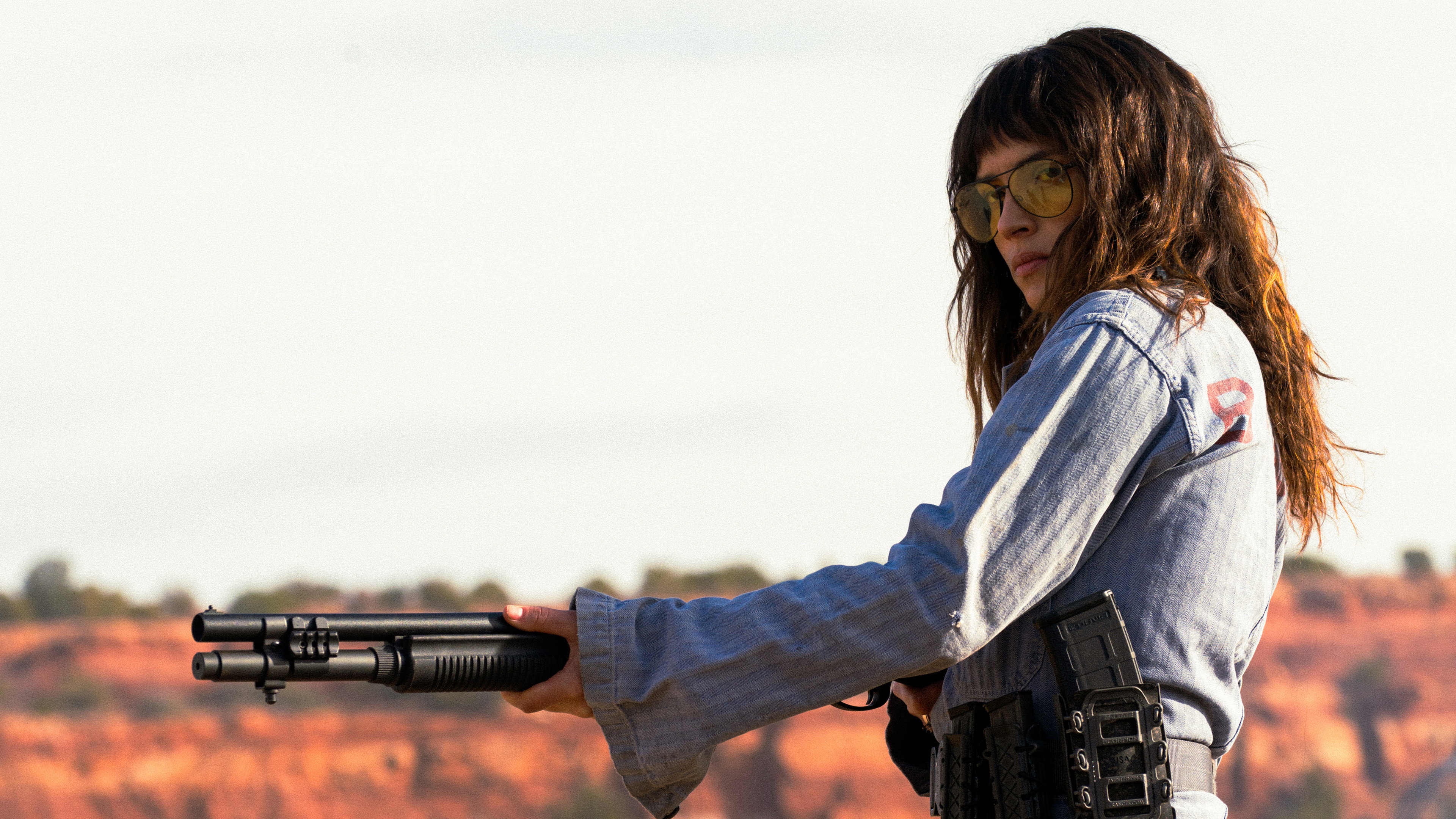Adria Arjona holding a shotgun in Onslaught HD Wallpaper
