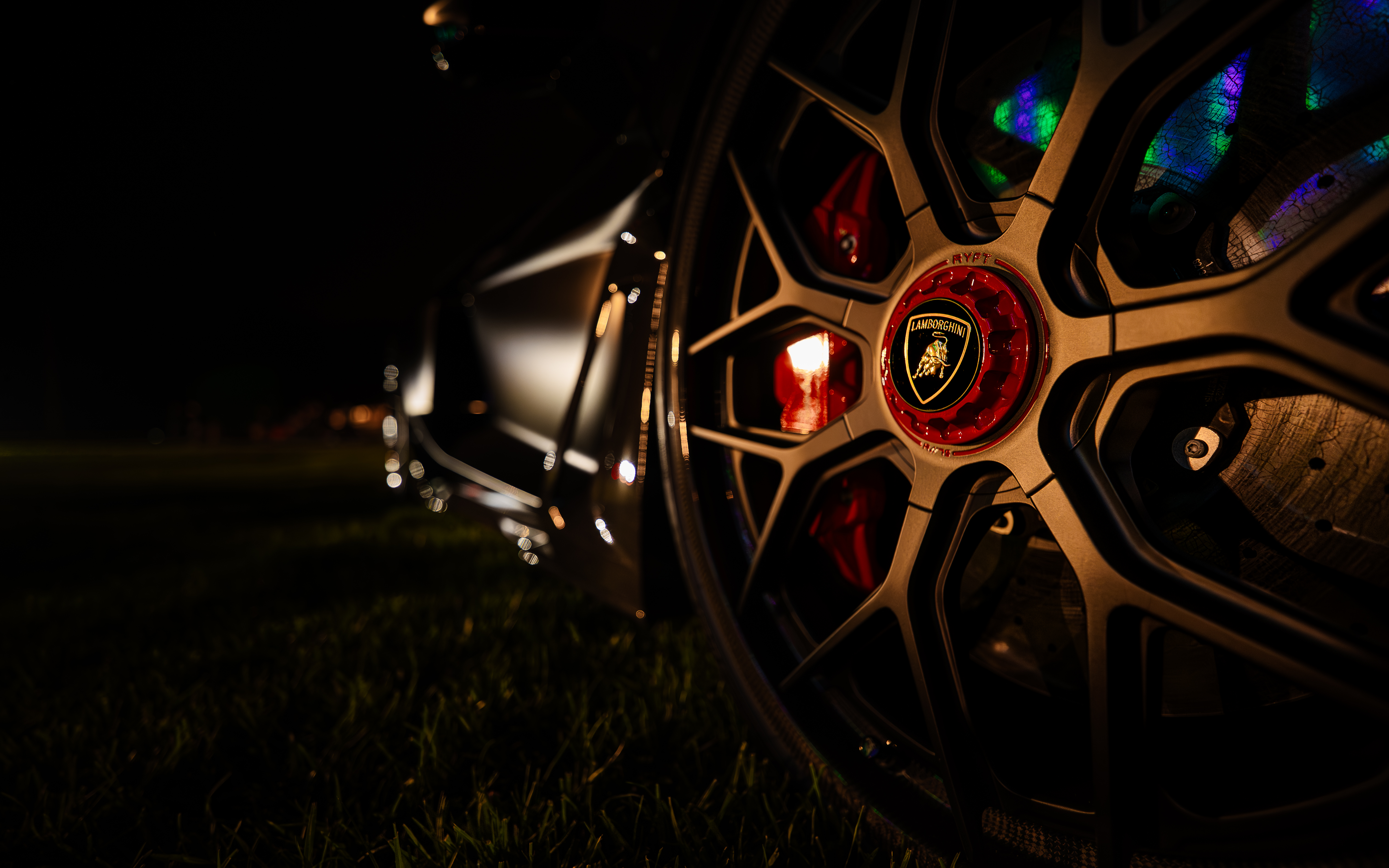 Close-up of a Lamborghini Wheel at Night HD Wallpaper