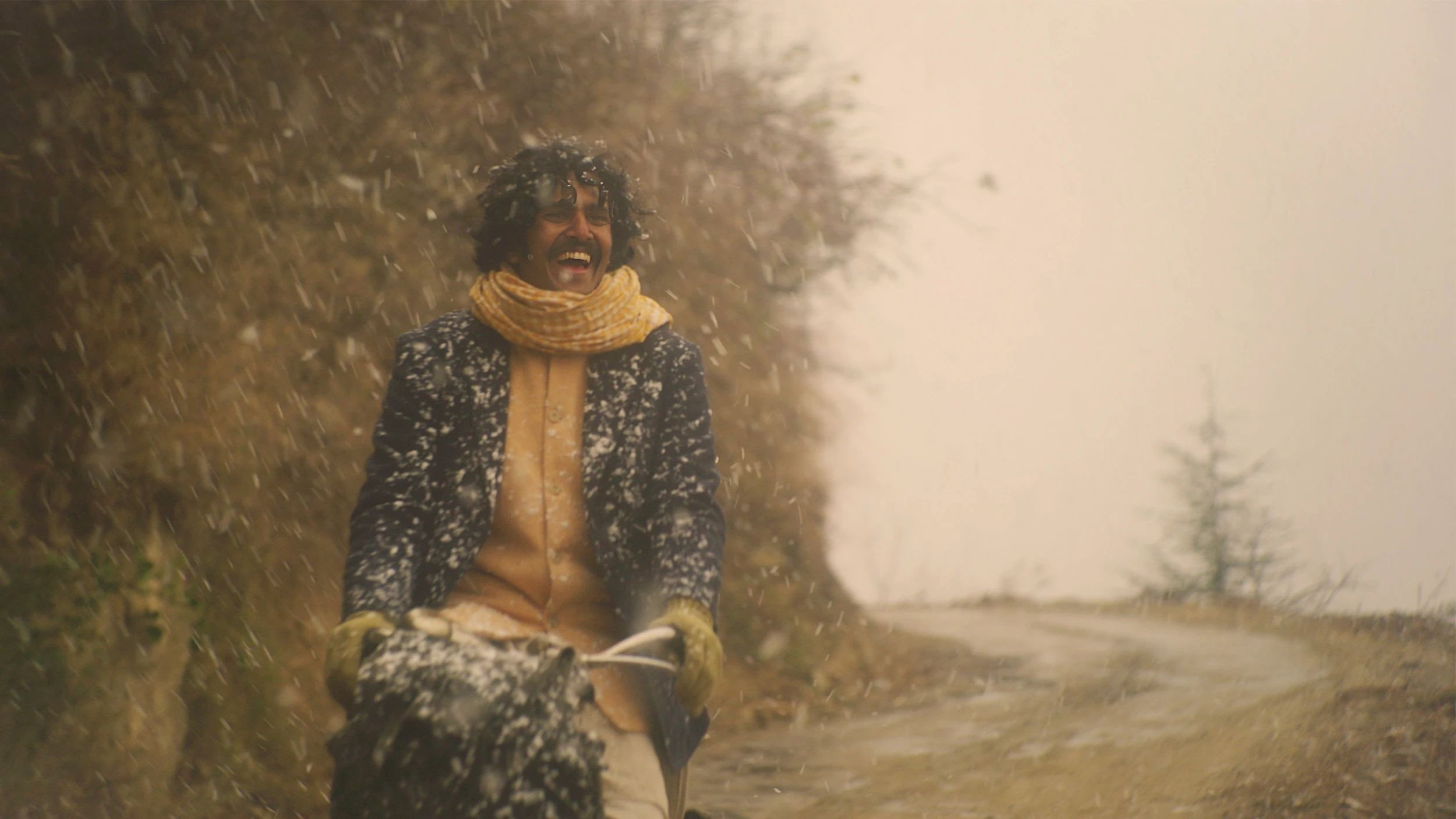 Man Riding Bicycle in Snow in The Cycle of Love HD Wallpaper