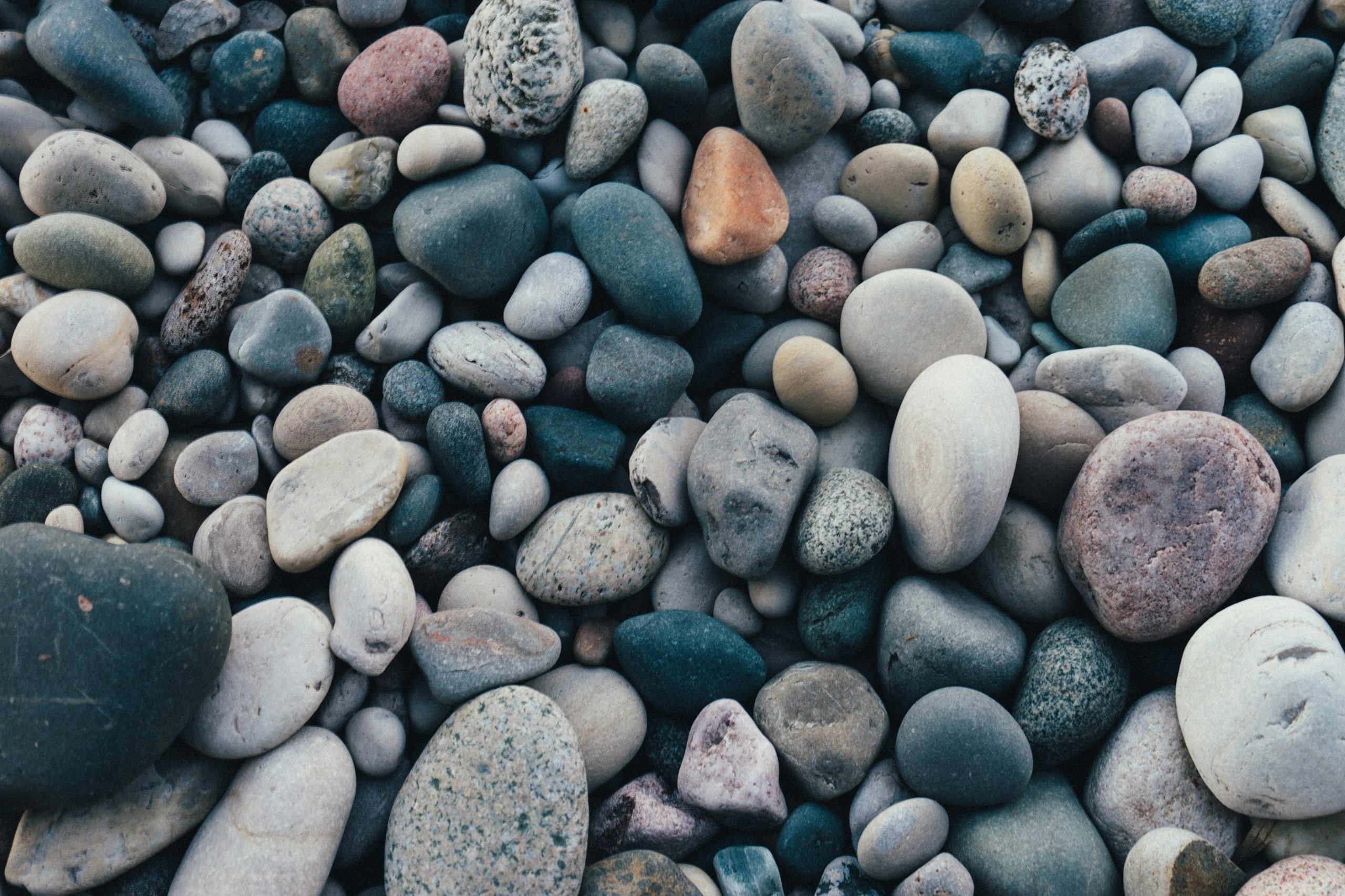 Close-Up of Assorted Smooth River Stones HD Wallpaper