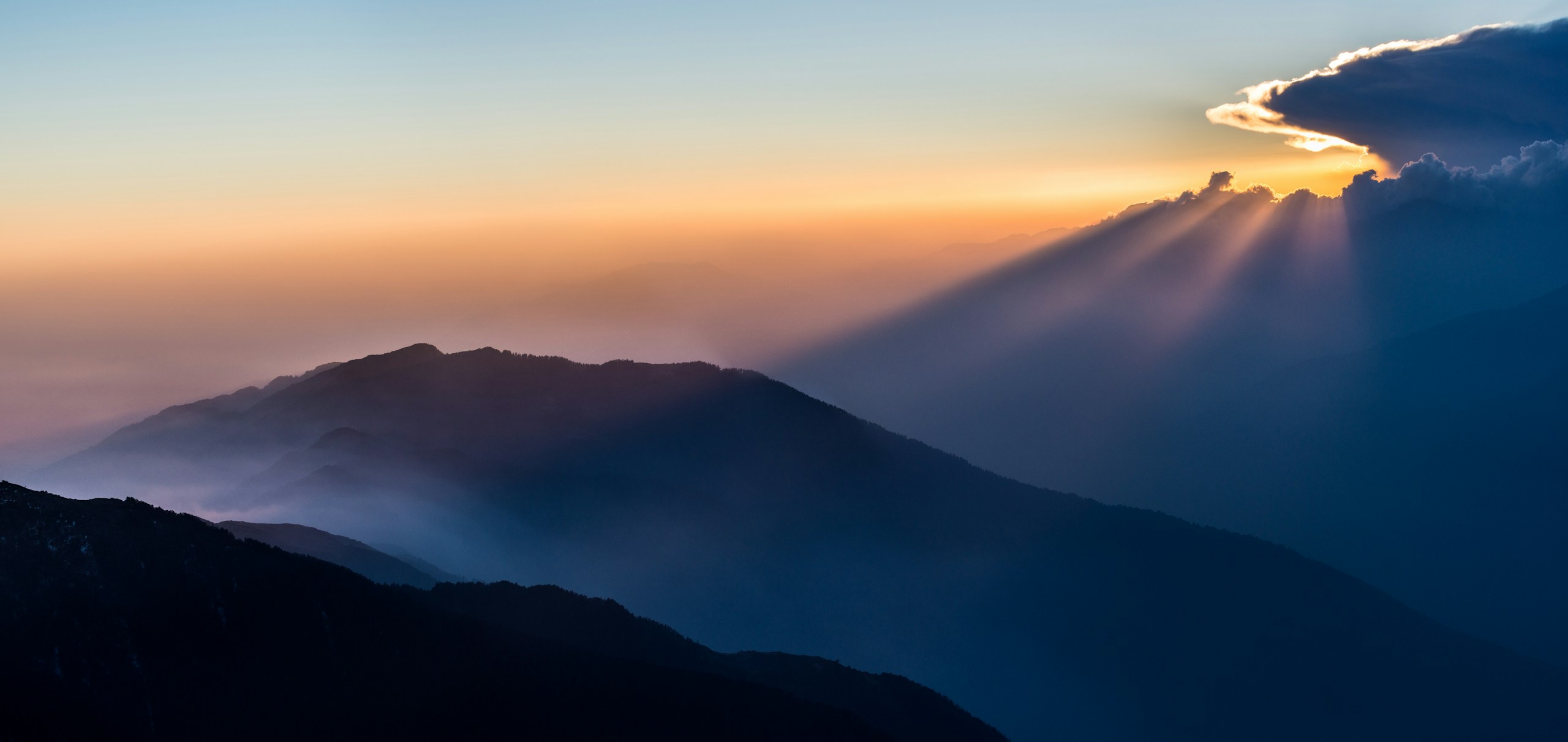 Sunset in the Himalayas with sun rays HD Wallpaper