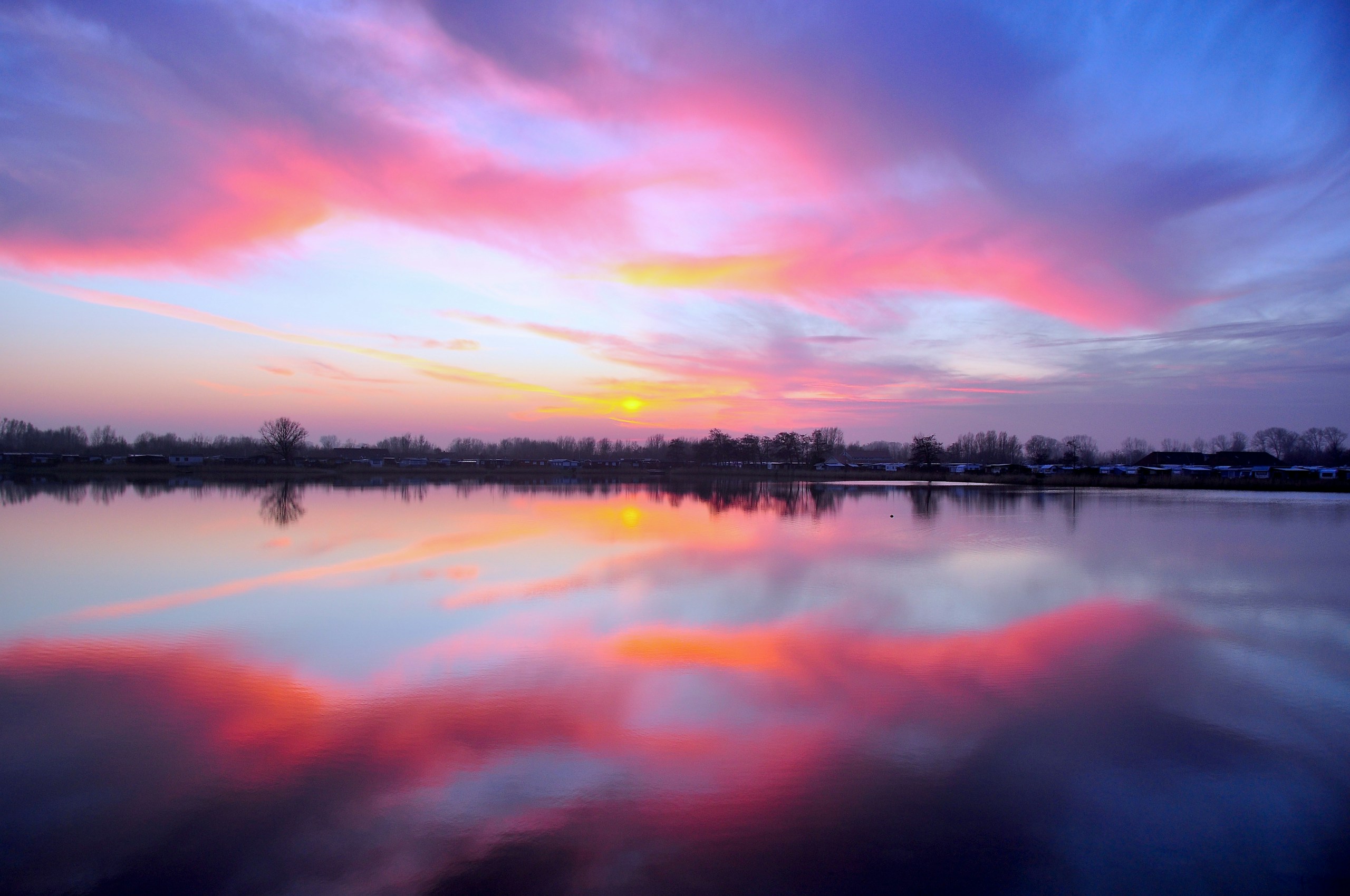 Pink and Purple Sunrise Reflection over Calm Water HD Wallpaper