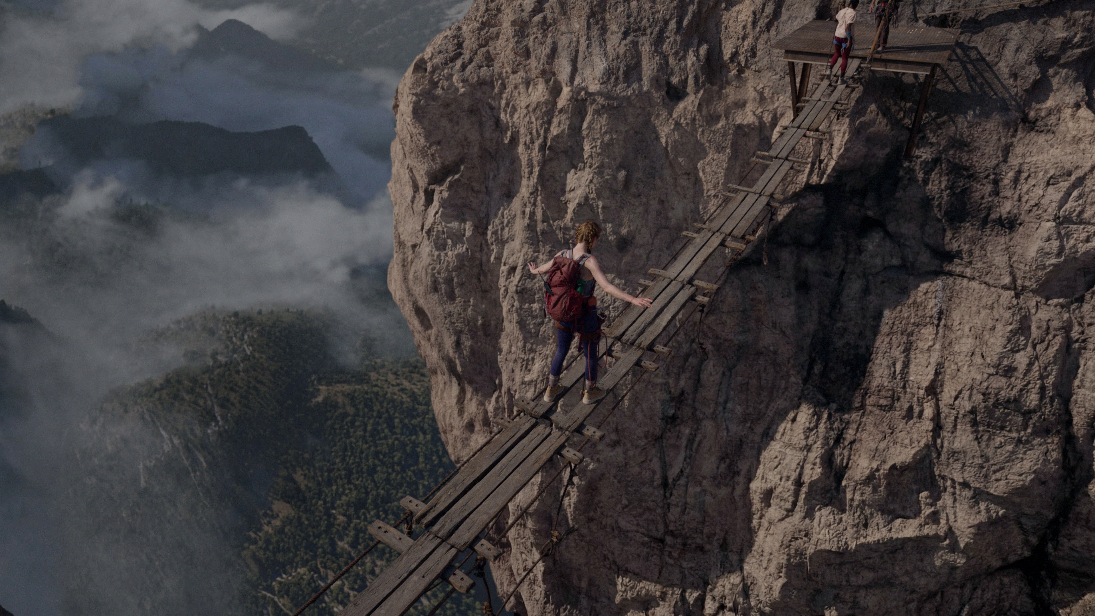 Woman crossing a precarious suspension bridge in Fall 2: Deadpoint HD Wallpaper