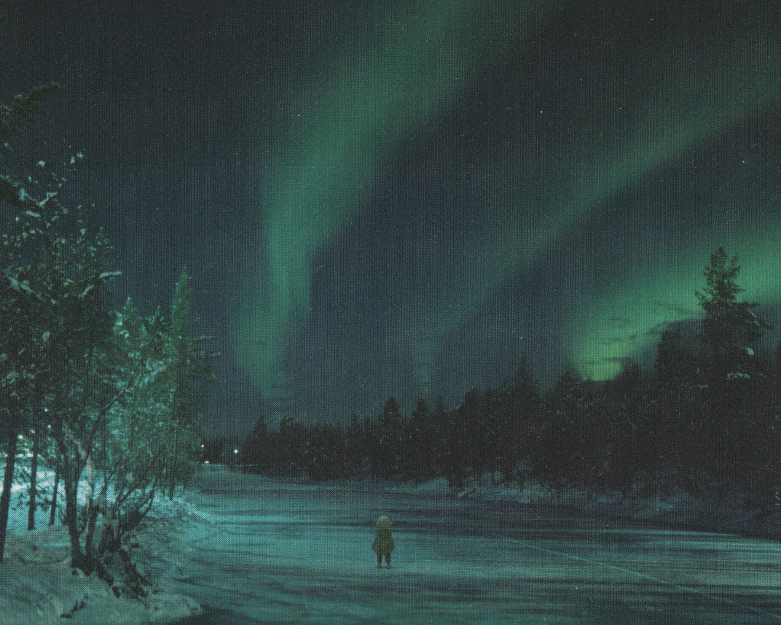 Small figure standing under the green Northern Lights HD Wallpaper
