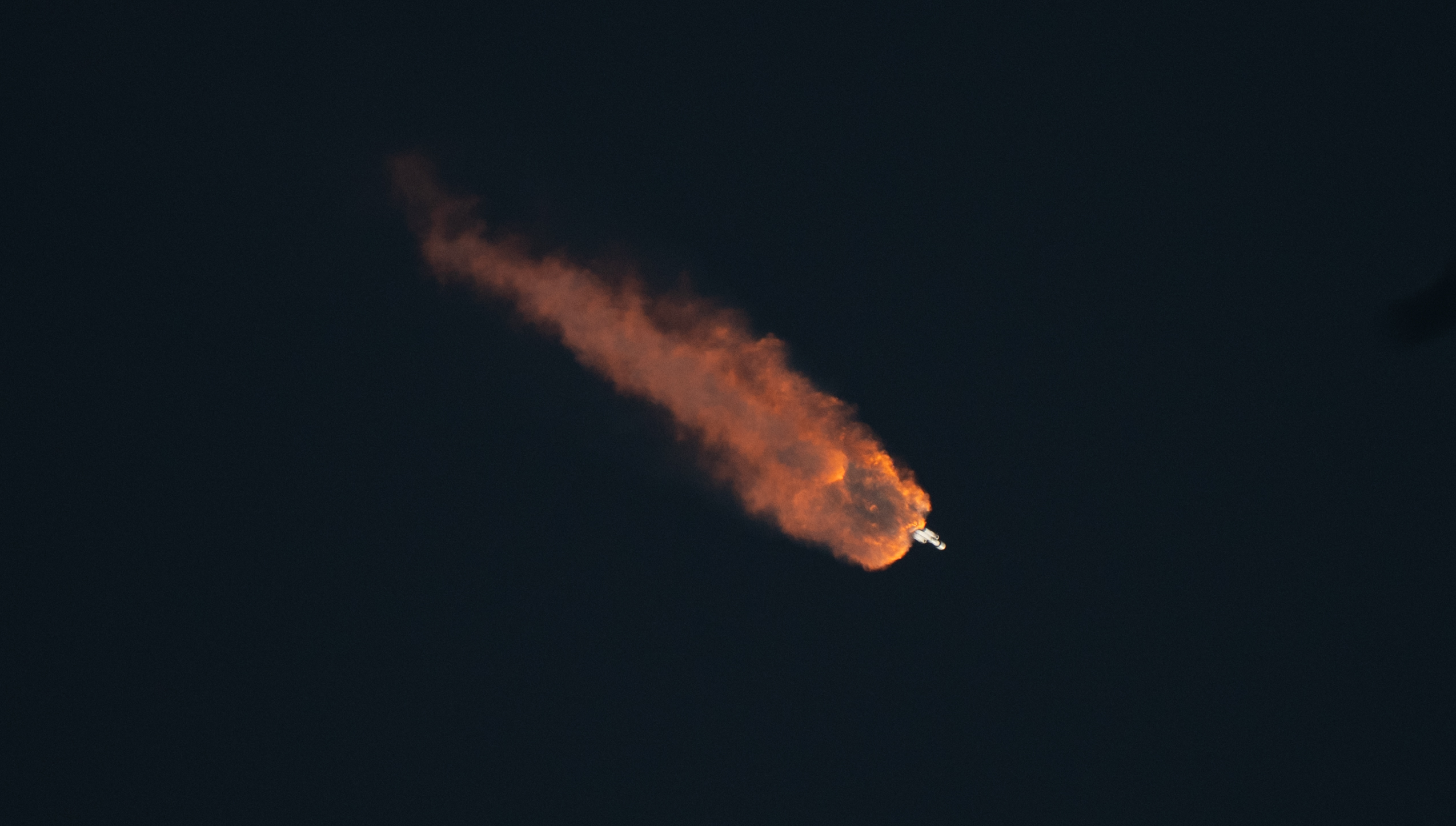 SpaceX Falcon Heavy Rocket Launch with Orange Plume HD Wallpaper