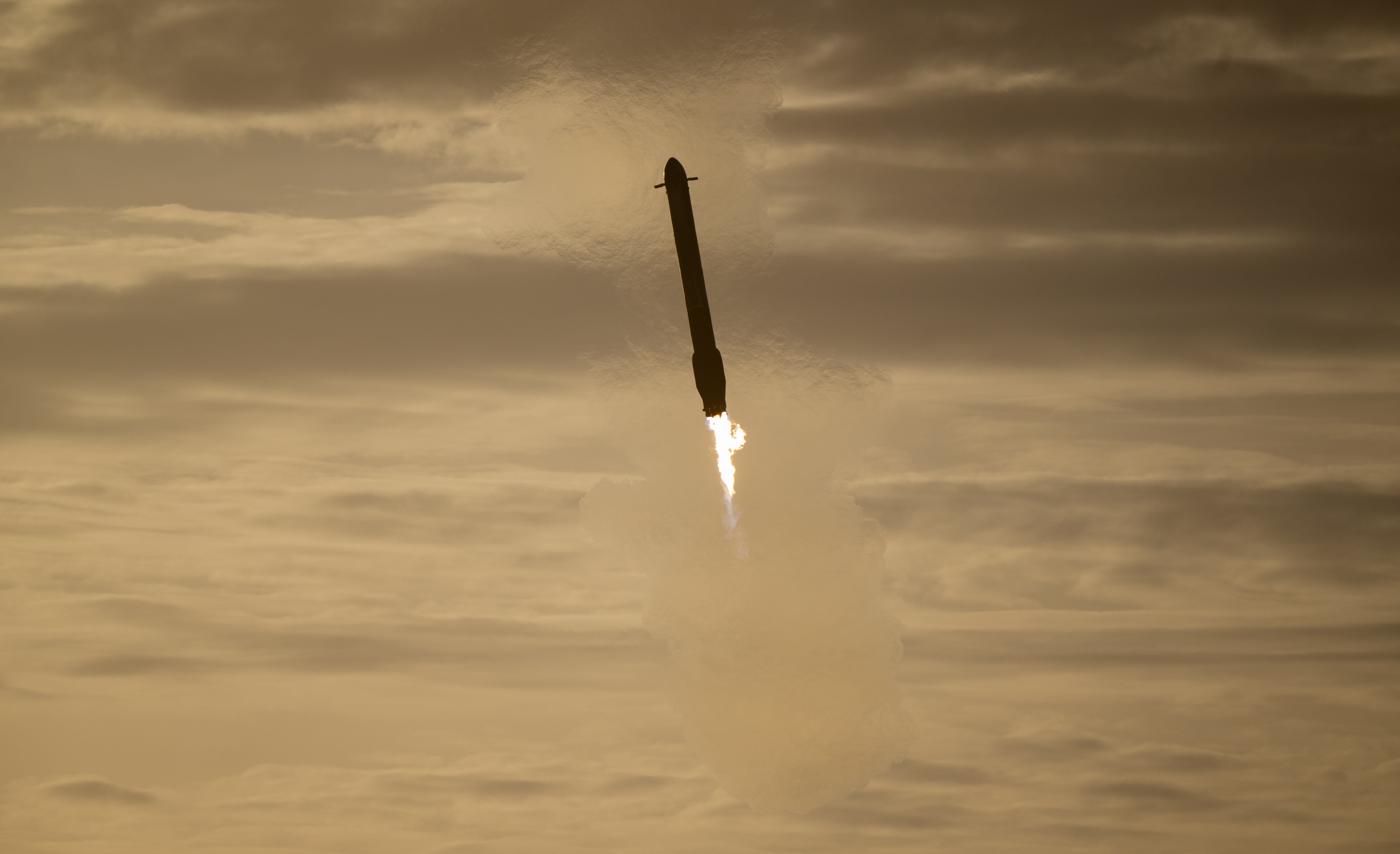 SpaceX Falcon Rocket Booster Descending Through Clouds HD Wallpaper
