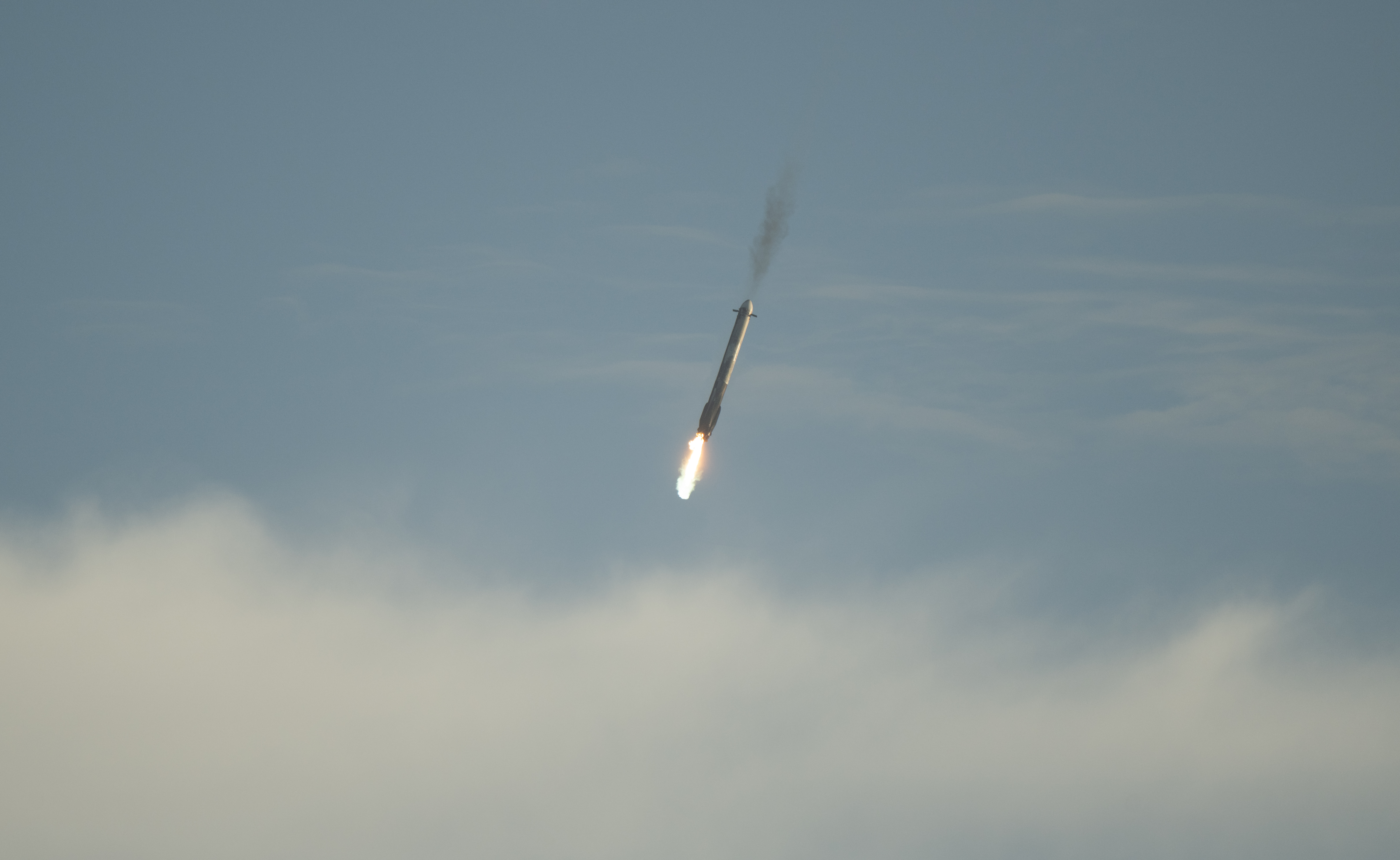 SpaceX Falcon Rocket Booster Descending Through Clouds HD Wallpaper