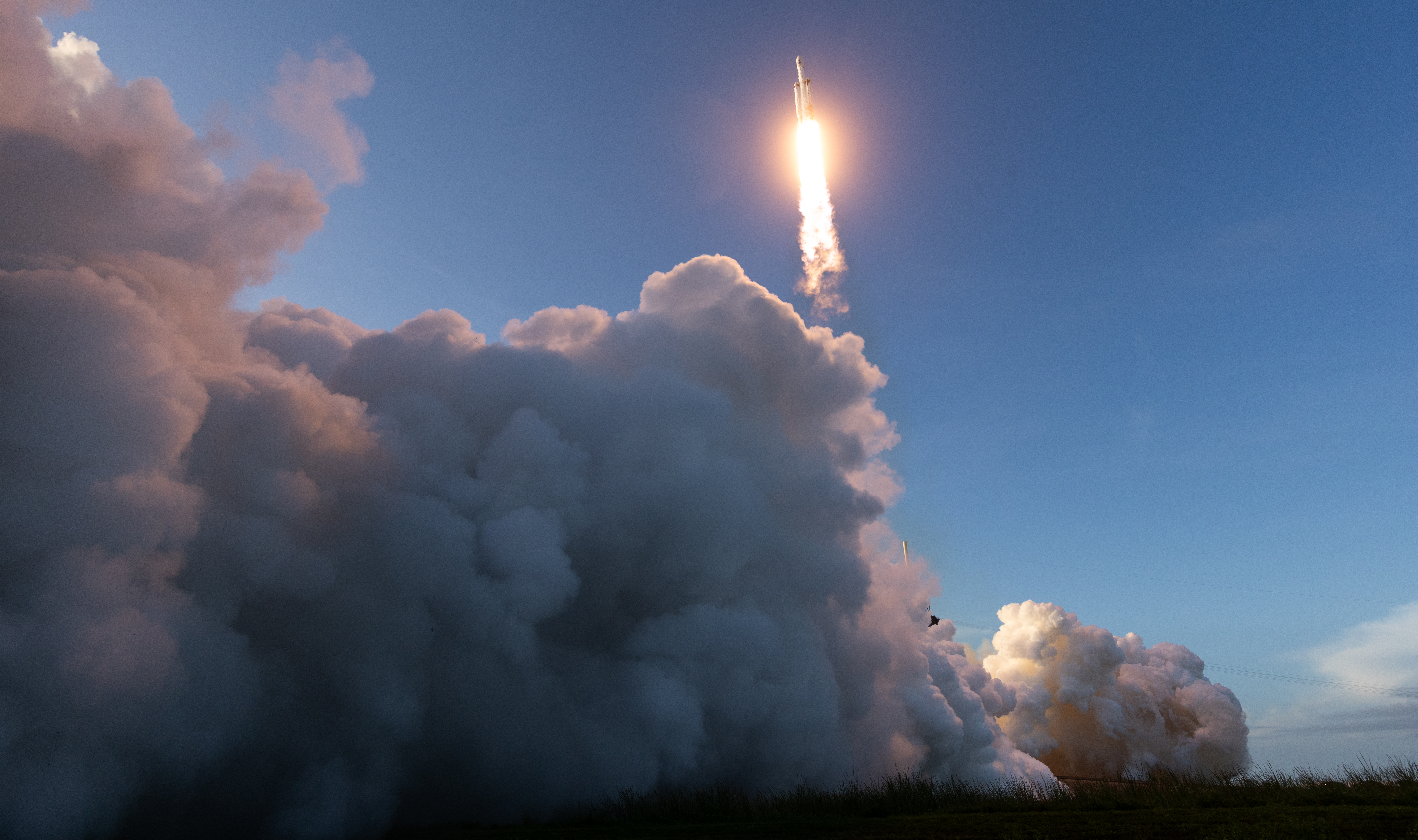 SpaceX Falcon Heavy Rocket Launching Into Blue Sky HD Wallpaper