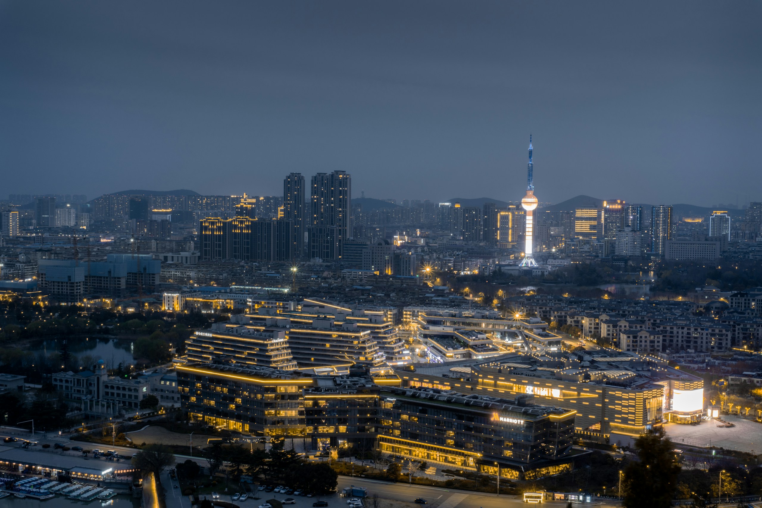 Aerial View of a City Skyline at Night HD Wallpaper