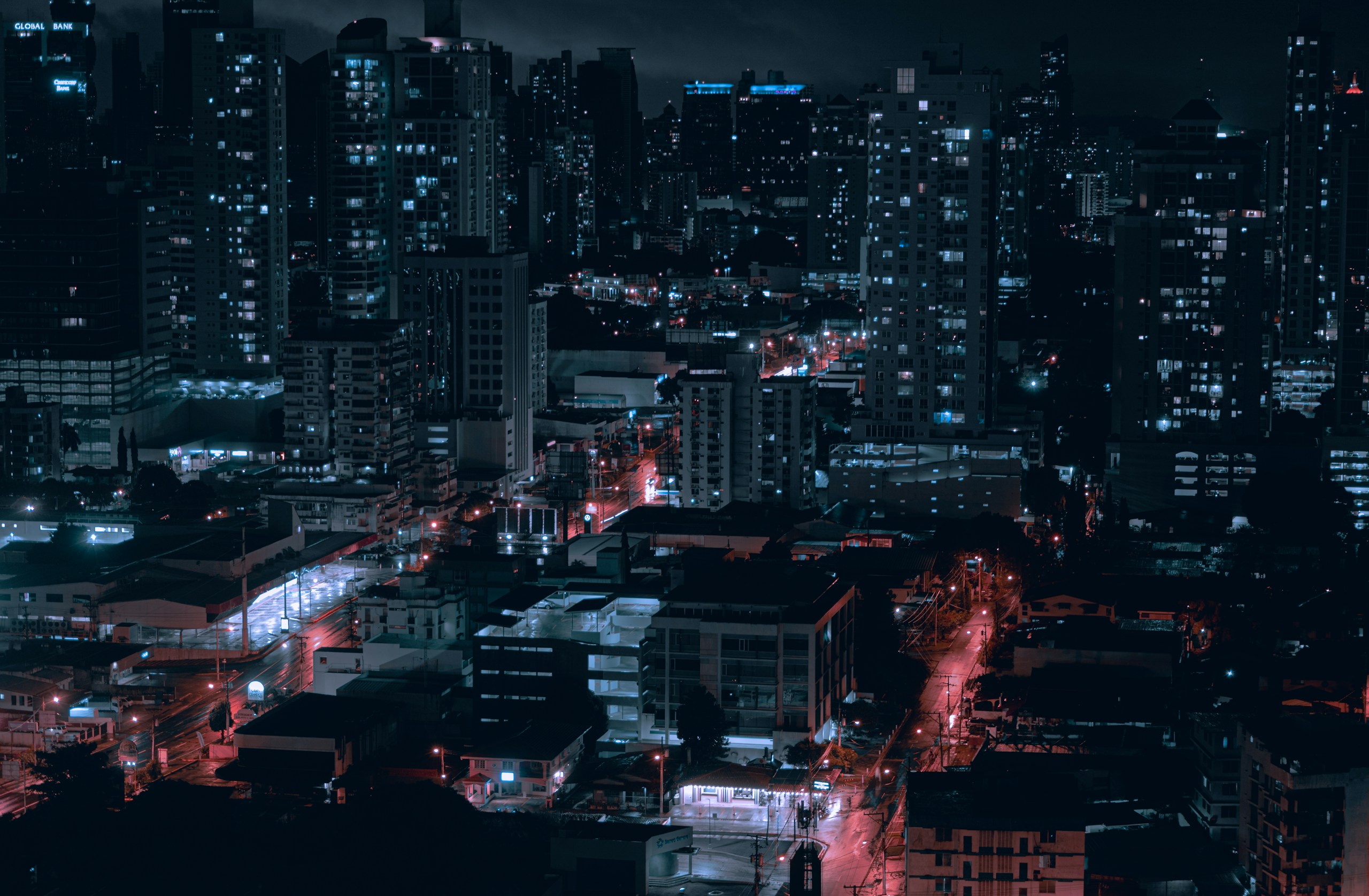 City skyline with high-rise buildings at night HD Wallpaper