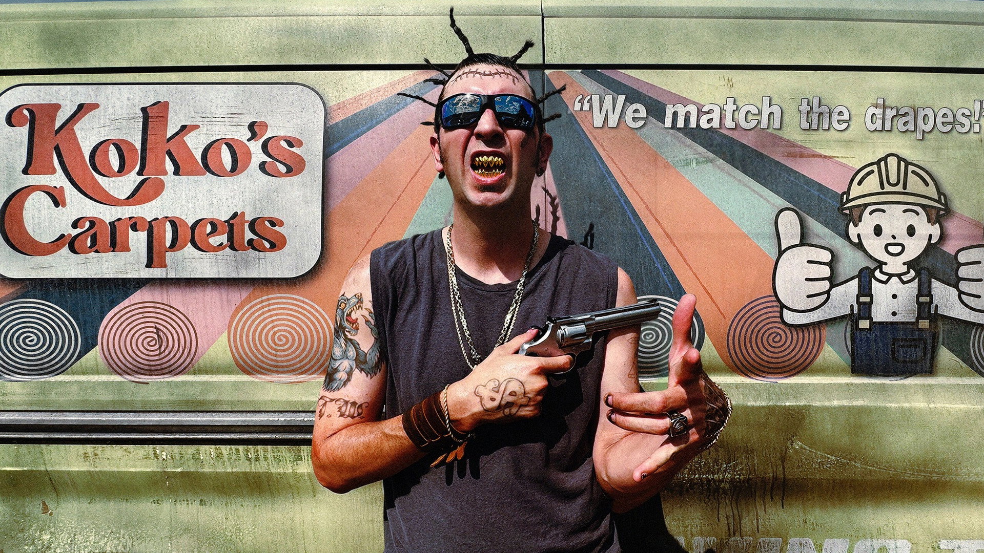 Man with revolver in front of Koko's Carpets van HD Wallpaper
