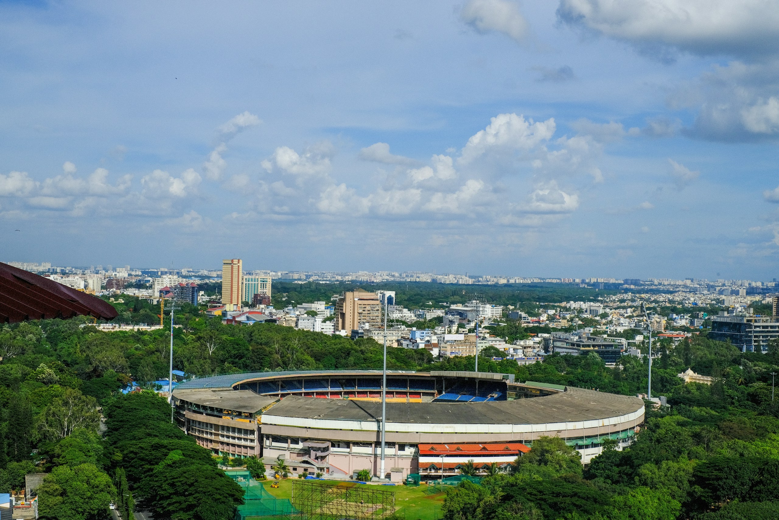 Aerial View of a Stadium and City Skyline HD Wallpaper