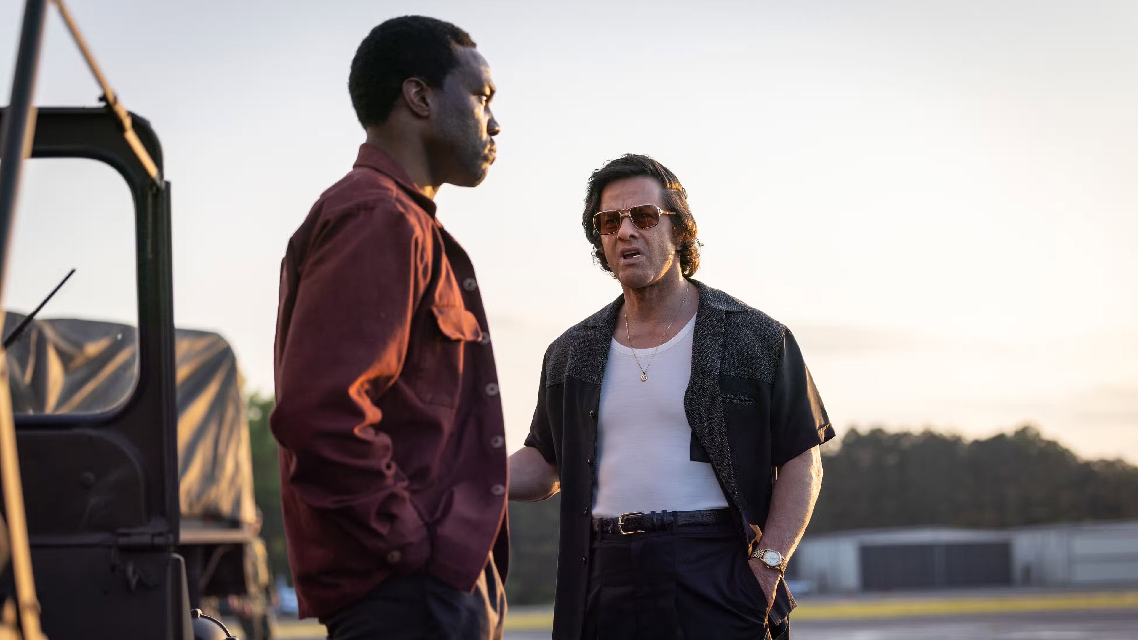 Two Men on an Airfield in By Any Means HD Wallpaper