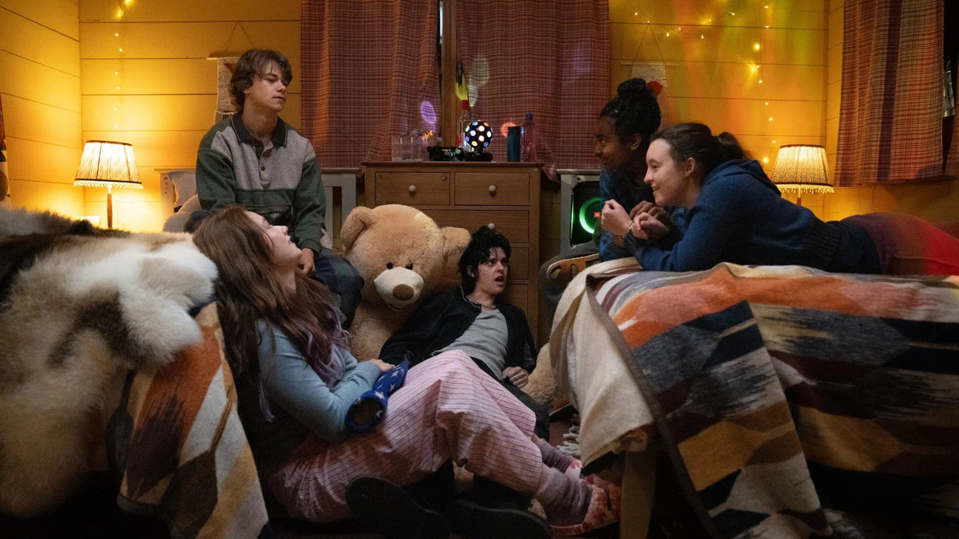 Group of teens in a bedroom with a teddy bear HD Wallpaper