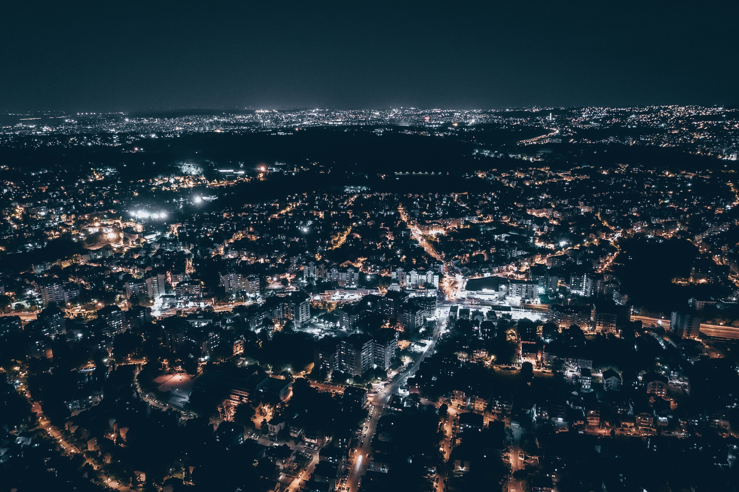 Aerial View of a City at Night HD Wallpaper