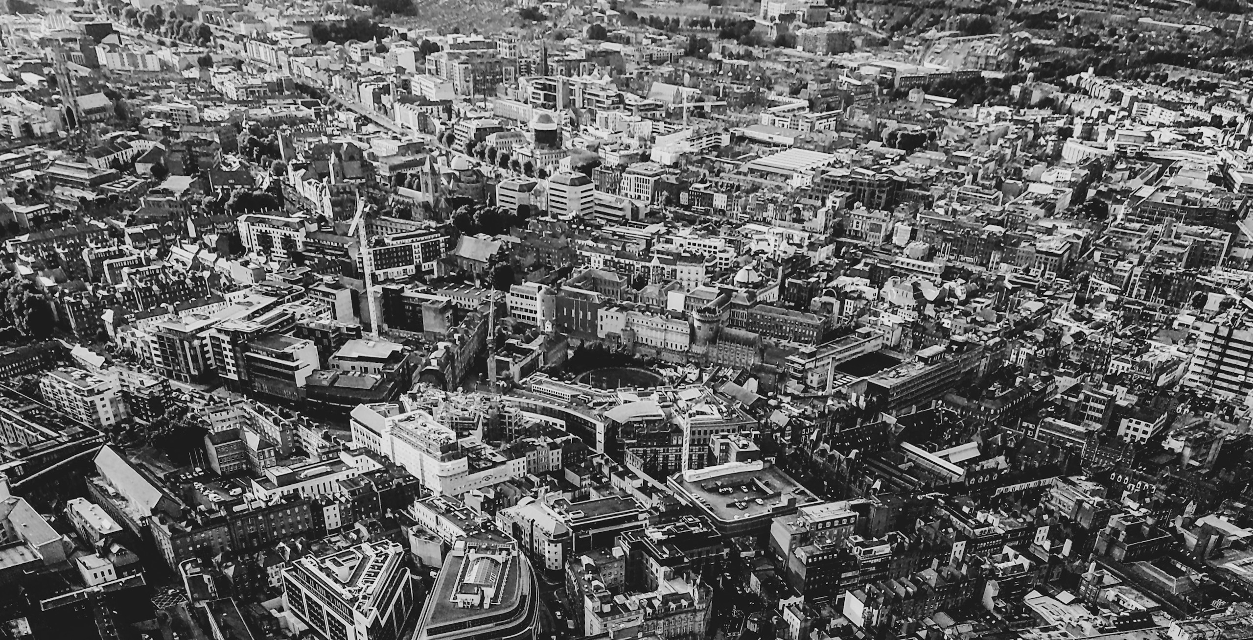 Aerial View of a Dense Cityscape in Black and White HD Wallpaper