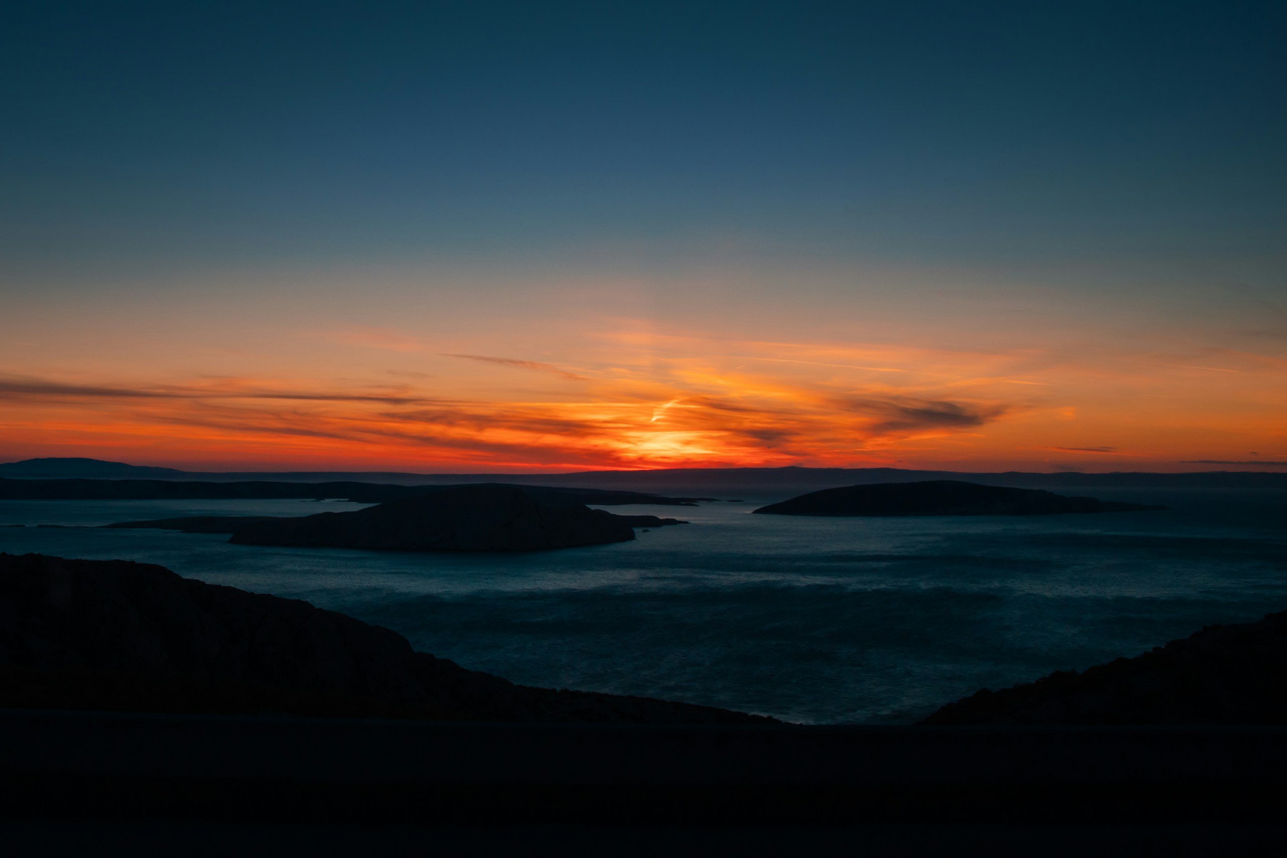 Sunset over islands and ocean HD Wallpaper