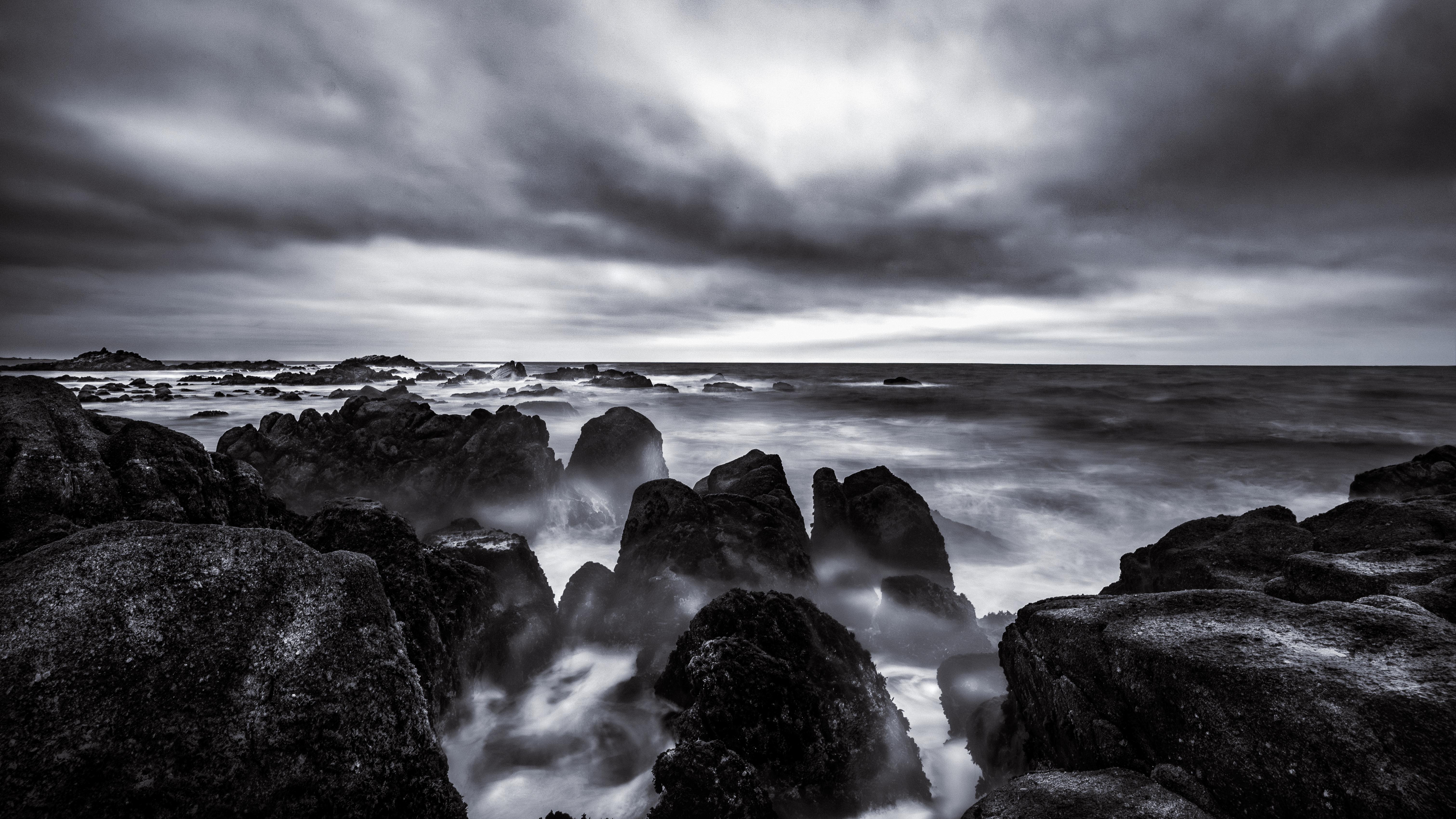 Dramatic Black and White Seascape with Jagged Rocks HD Wallpaper