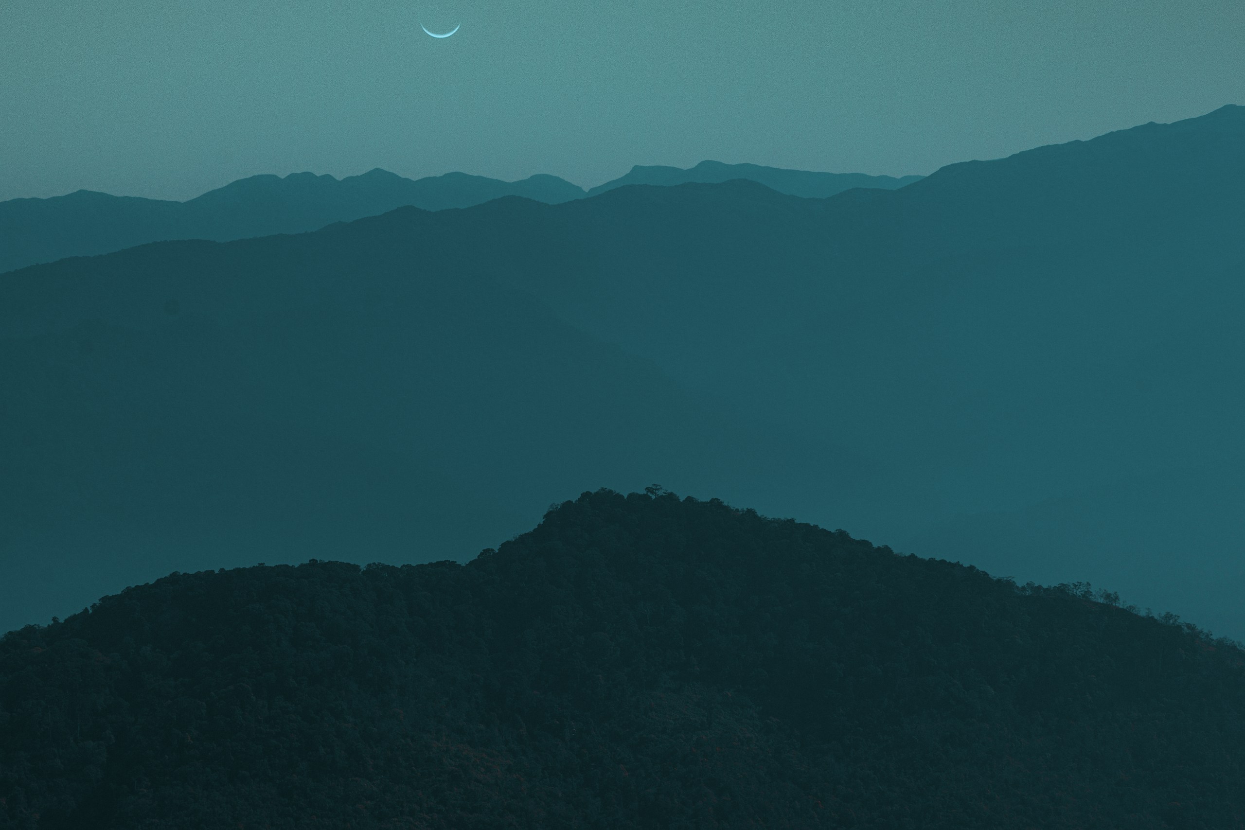 Crescent Moon Over Misty Mountain Ranges HD Wallpaper