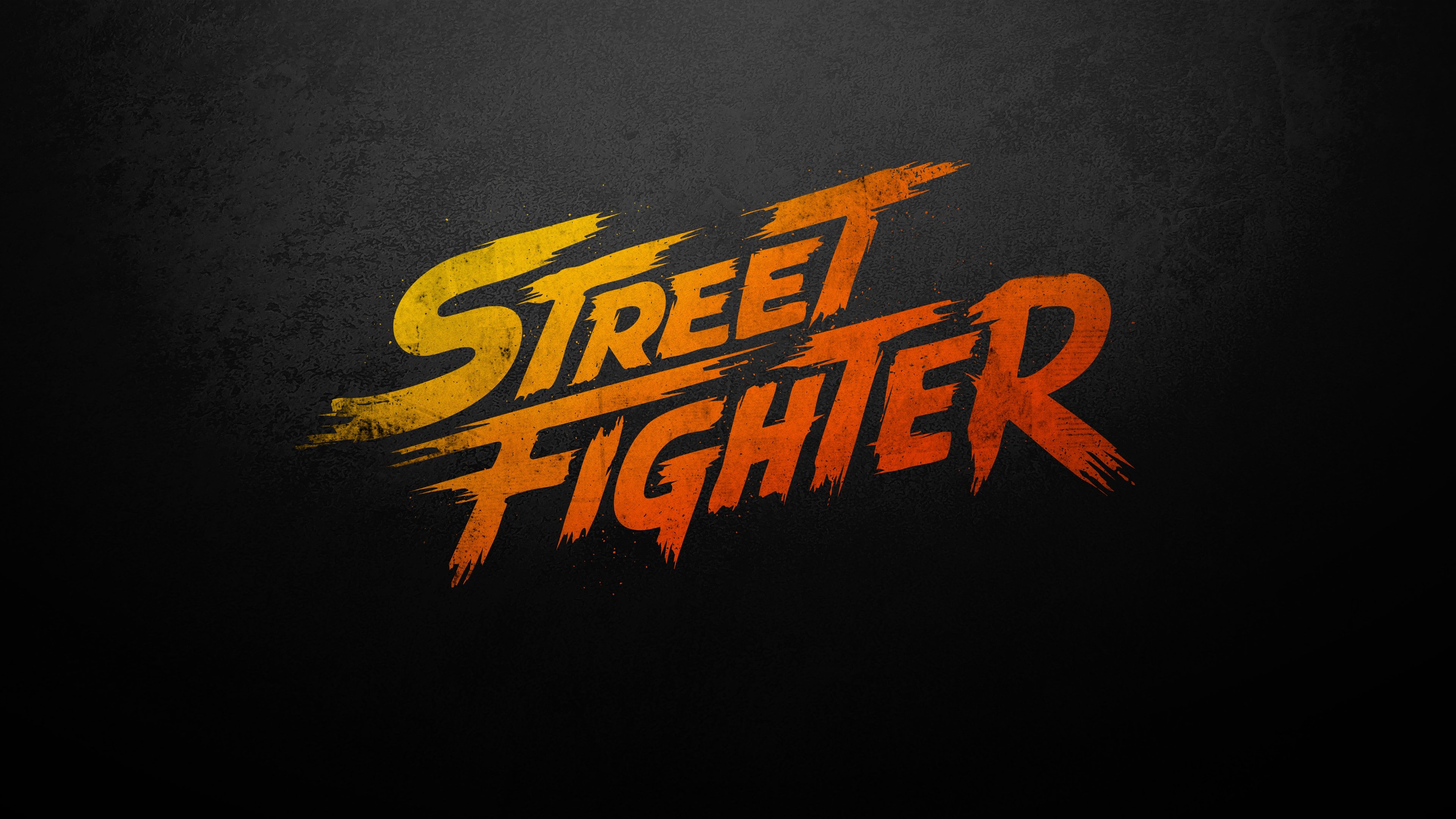 Street Fighter logo on a dark textured background HD Wallpaper