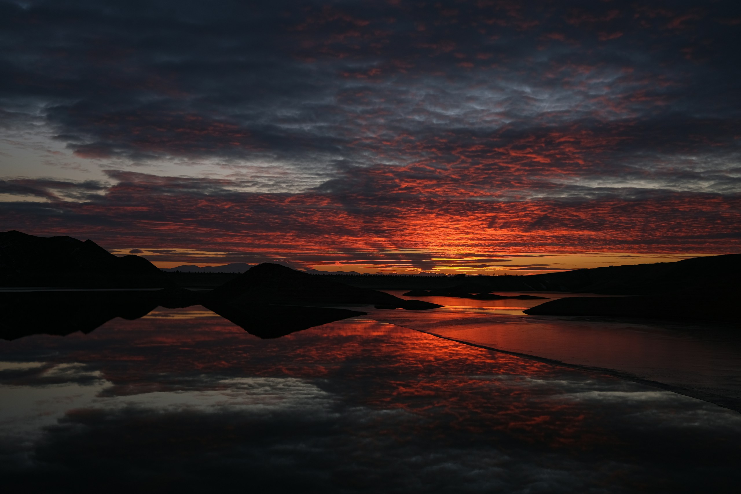 Sunset over a lake with mountains HD Wallpaper