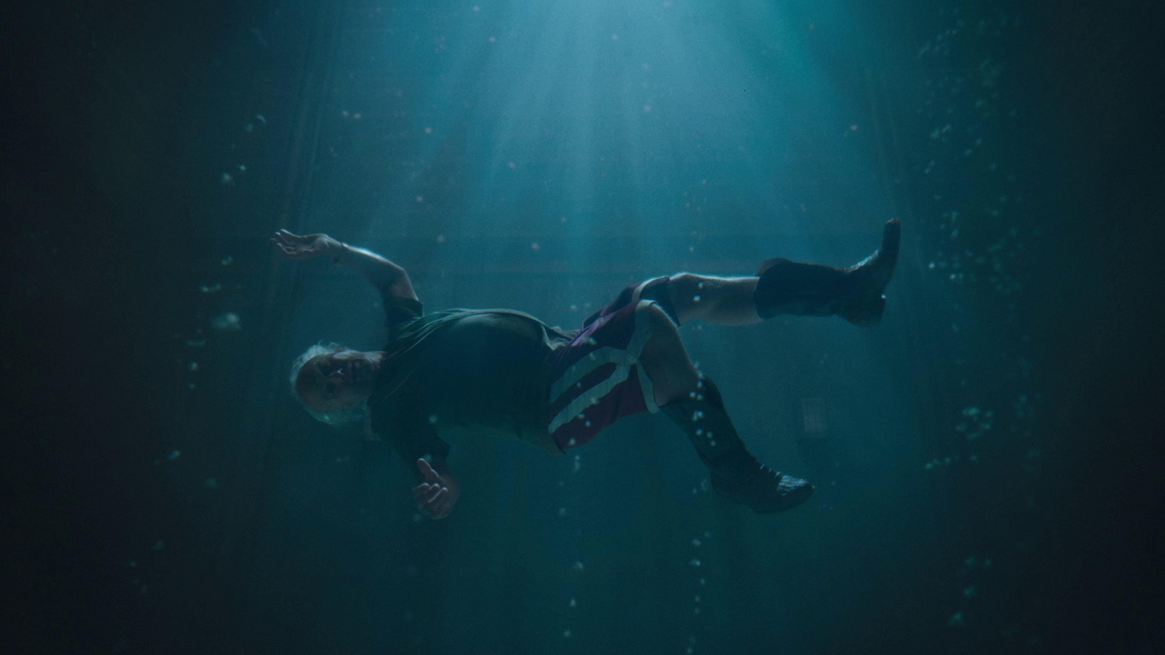 Man floating underwater in Digger movie HD Wallpaper