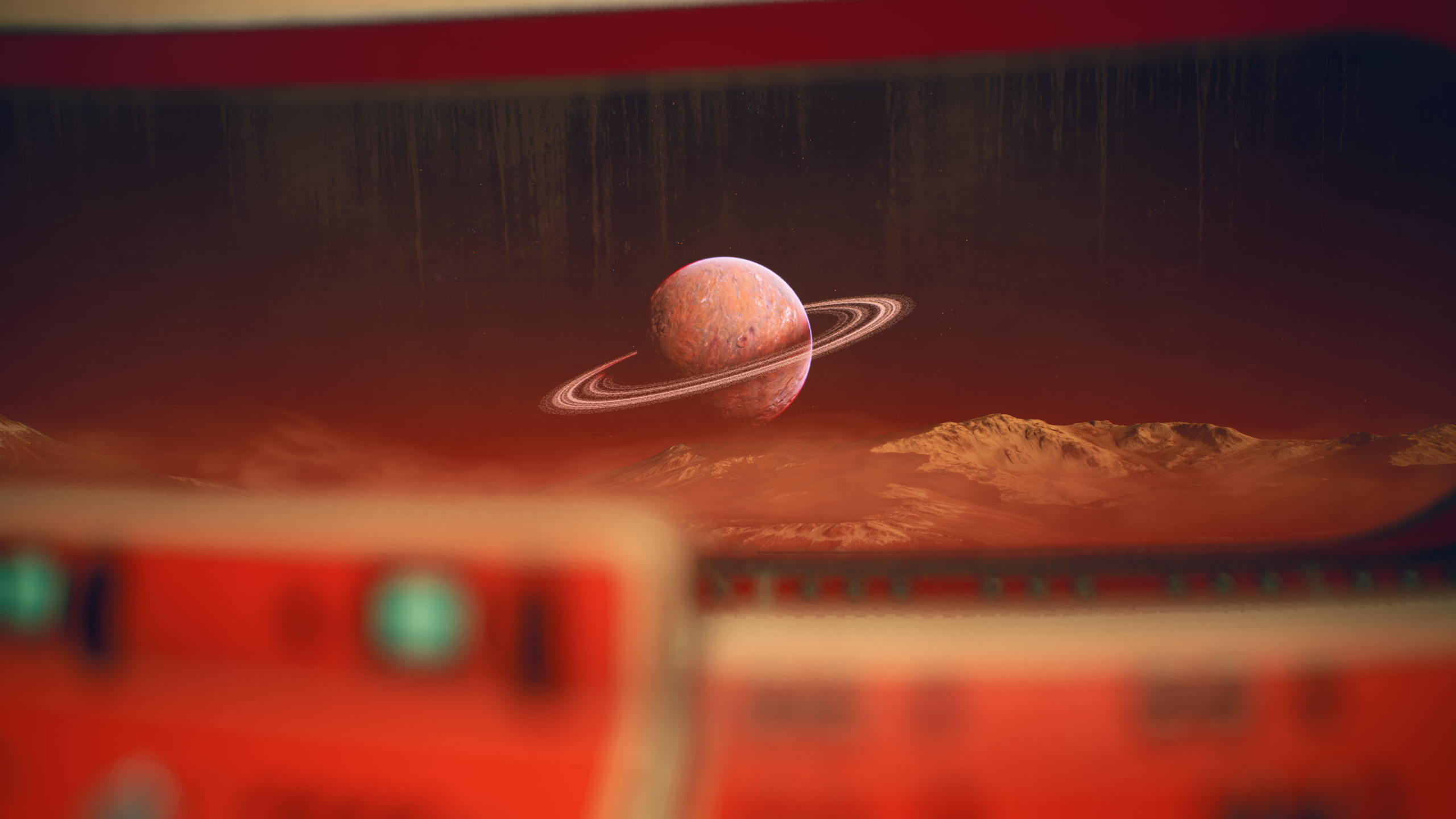 Ringed planet over a desolate, rocky landscape HD Wallpaper